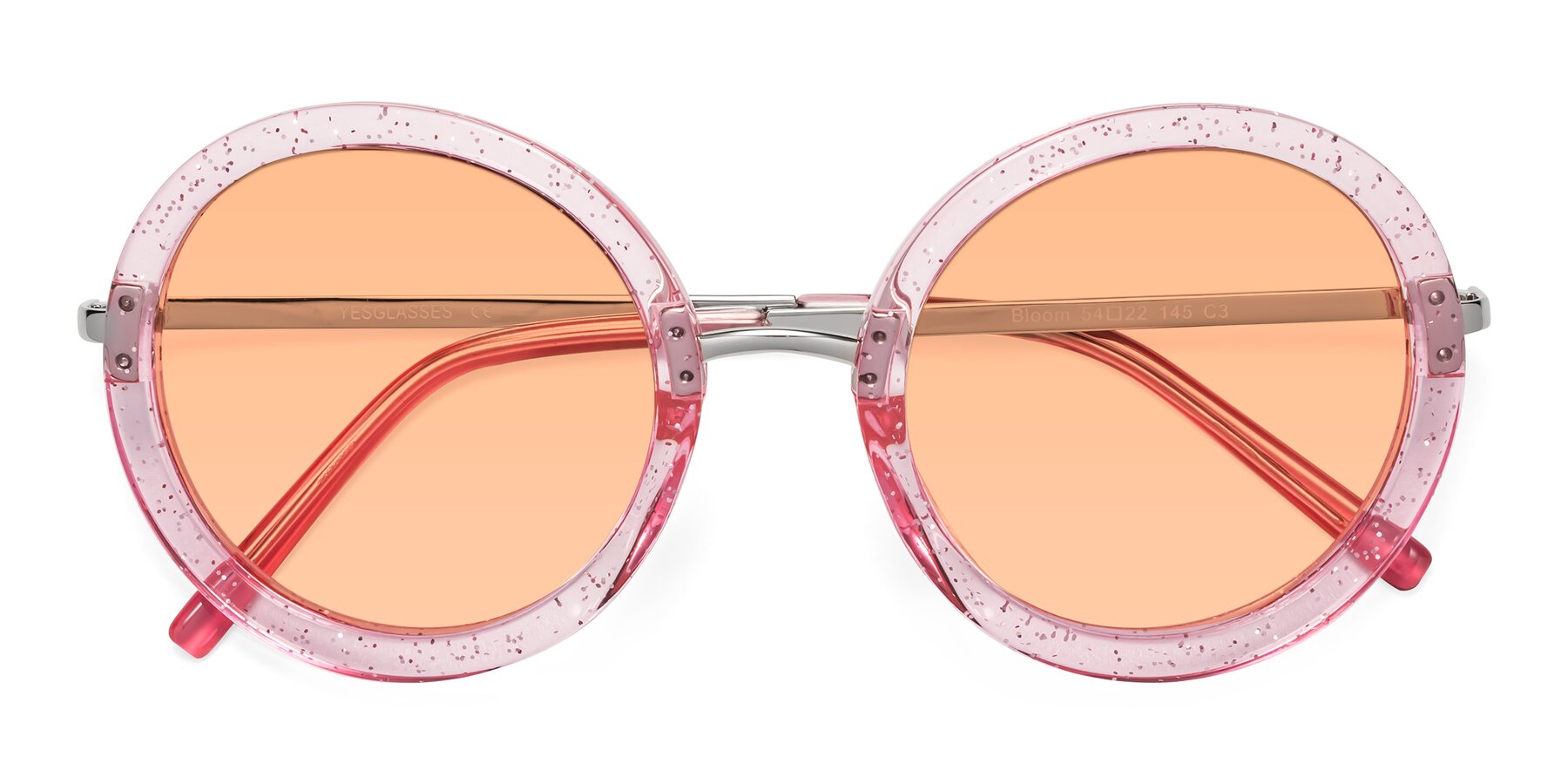 Folded Front of Bloom in Transparent Pearl Pink with Light Orange Tinted Lenses