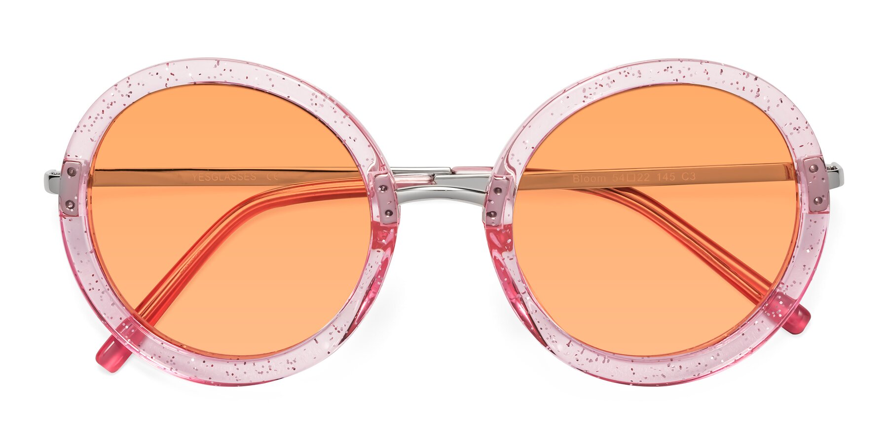 Folded Front of Bloom in Transparent Pearl Pink with Medium Orange Tinted Lenses