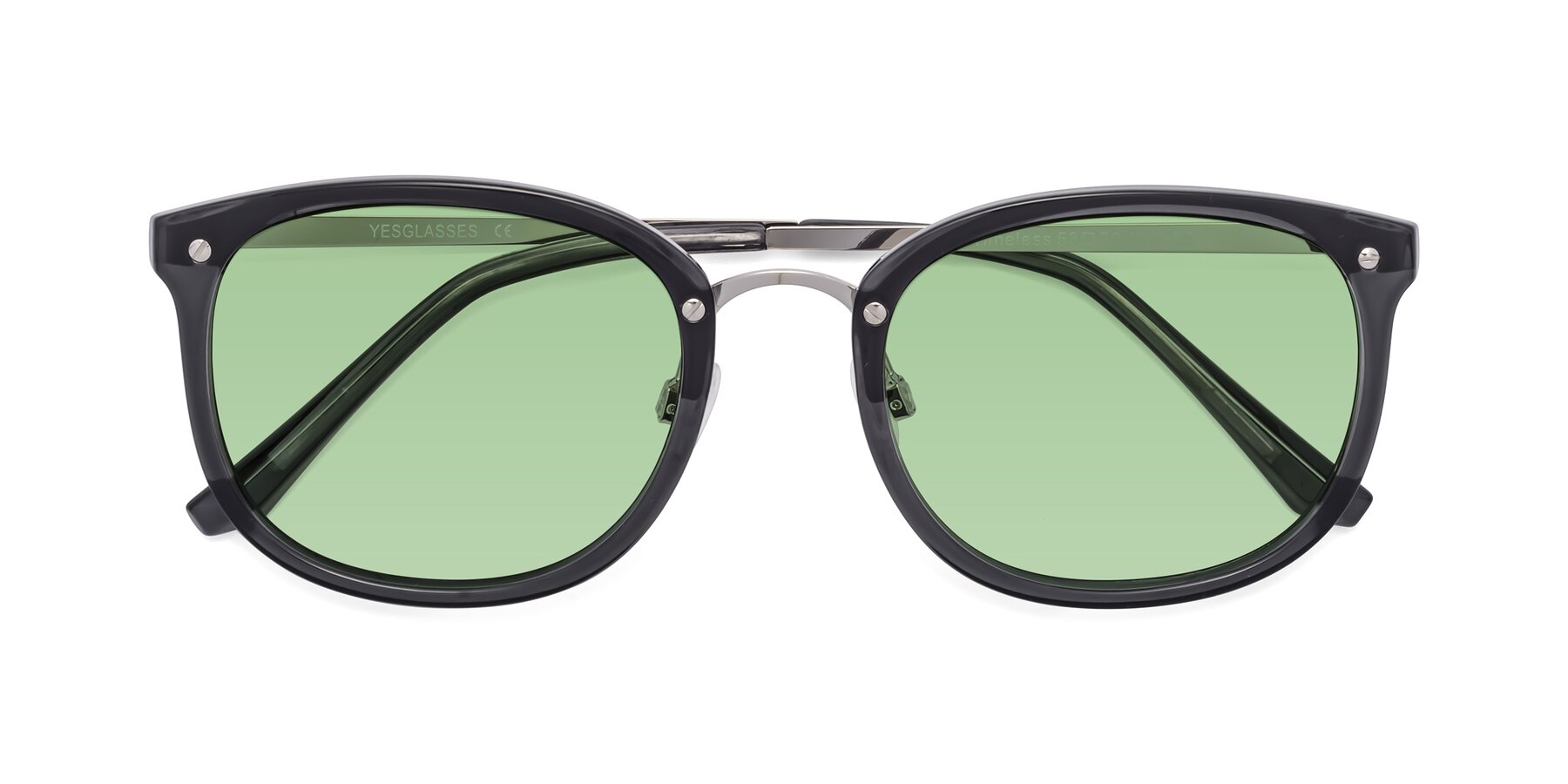 Folded Front of Timeless in Transparent Gray with Medium Green Tinted Lenses