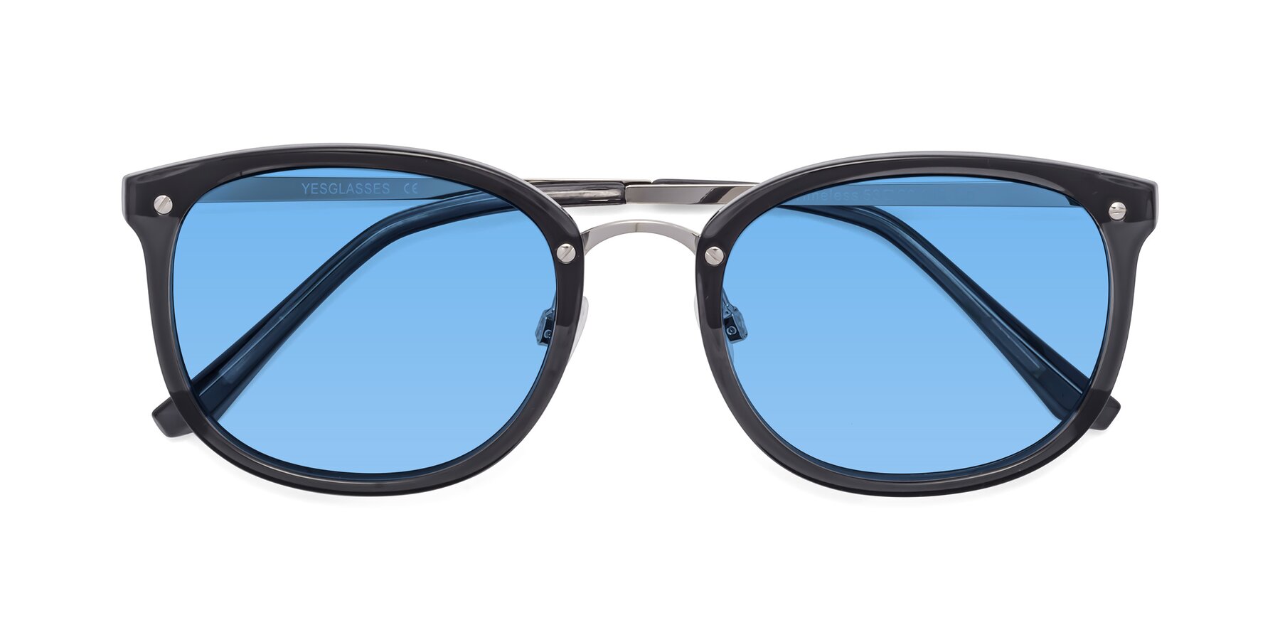 Folded Front of Timeless in Transparent Gray with Medium Blue Tinted Lenses