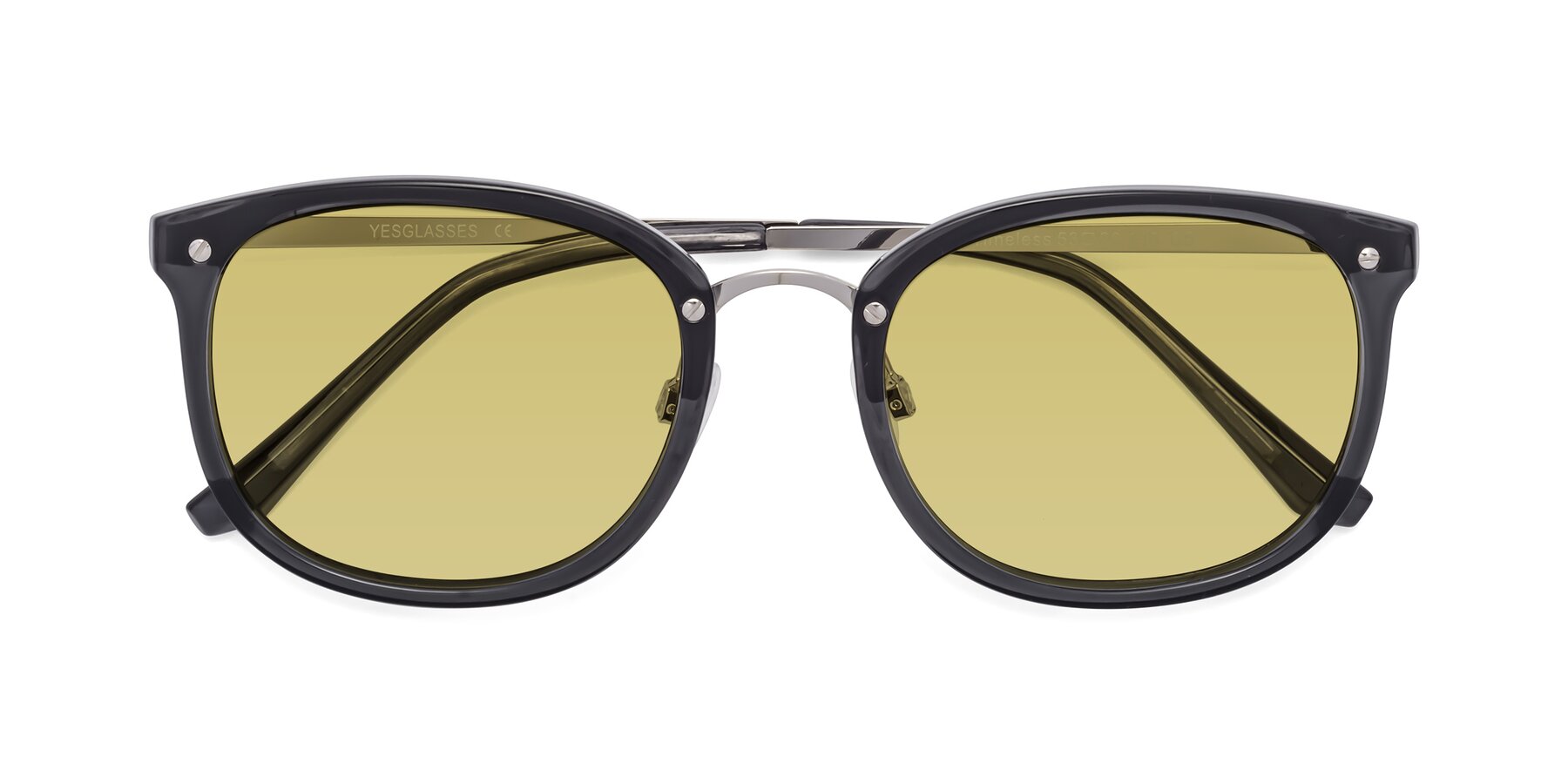 Folded Front of Timeless in Transparent Gray with Medium Champagne Tinted Lenses