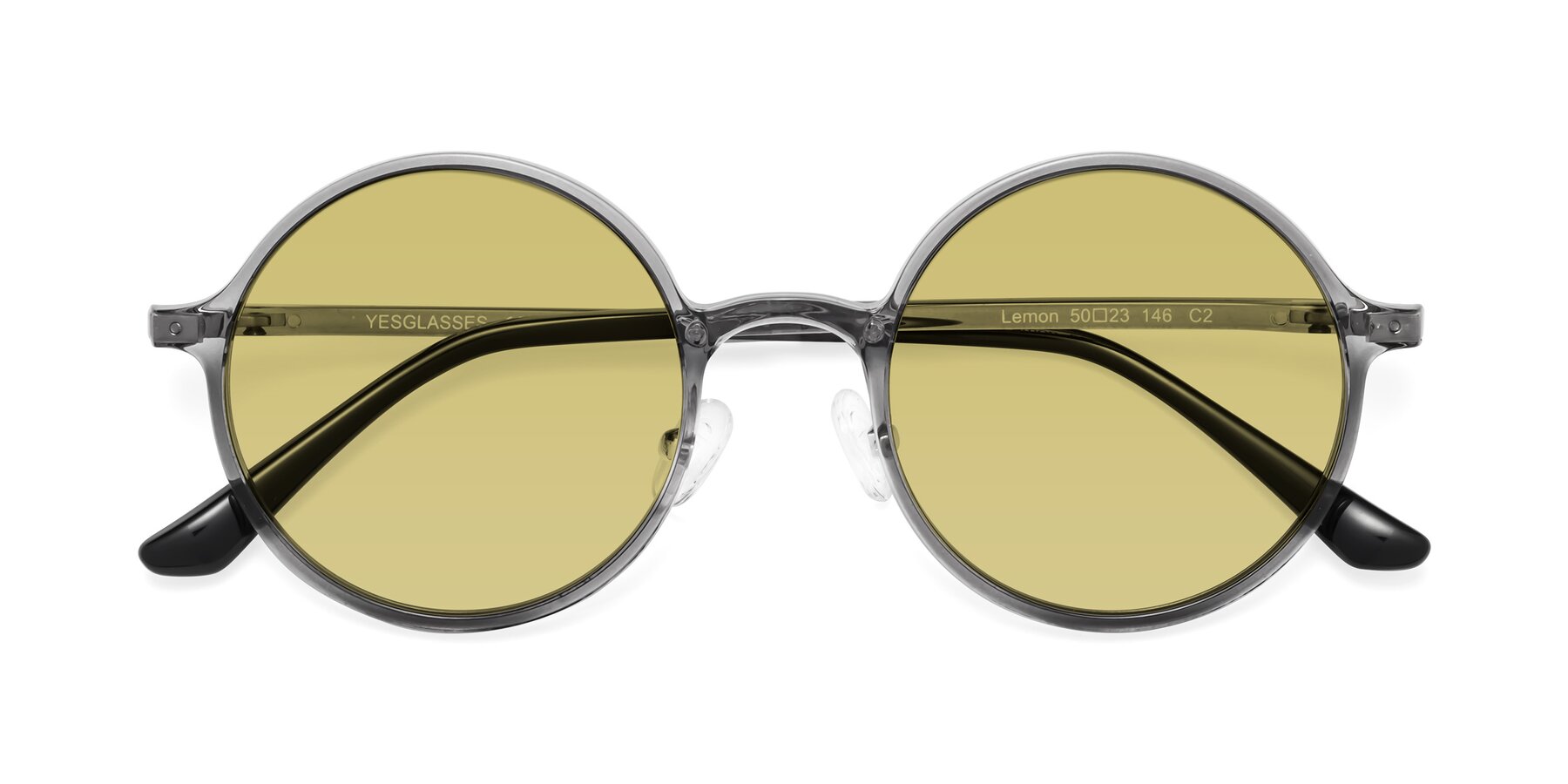 Folded Front of Lemon in Transparent Gray with Medium Champagne Tinted Lenses