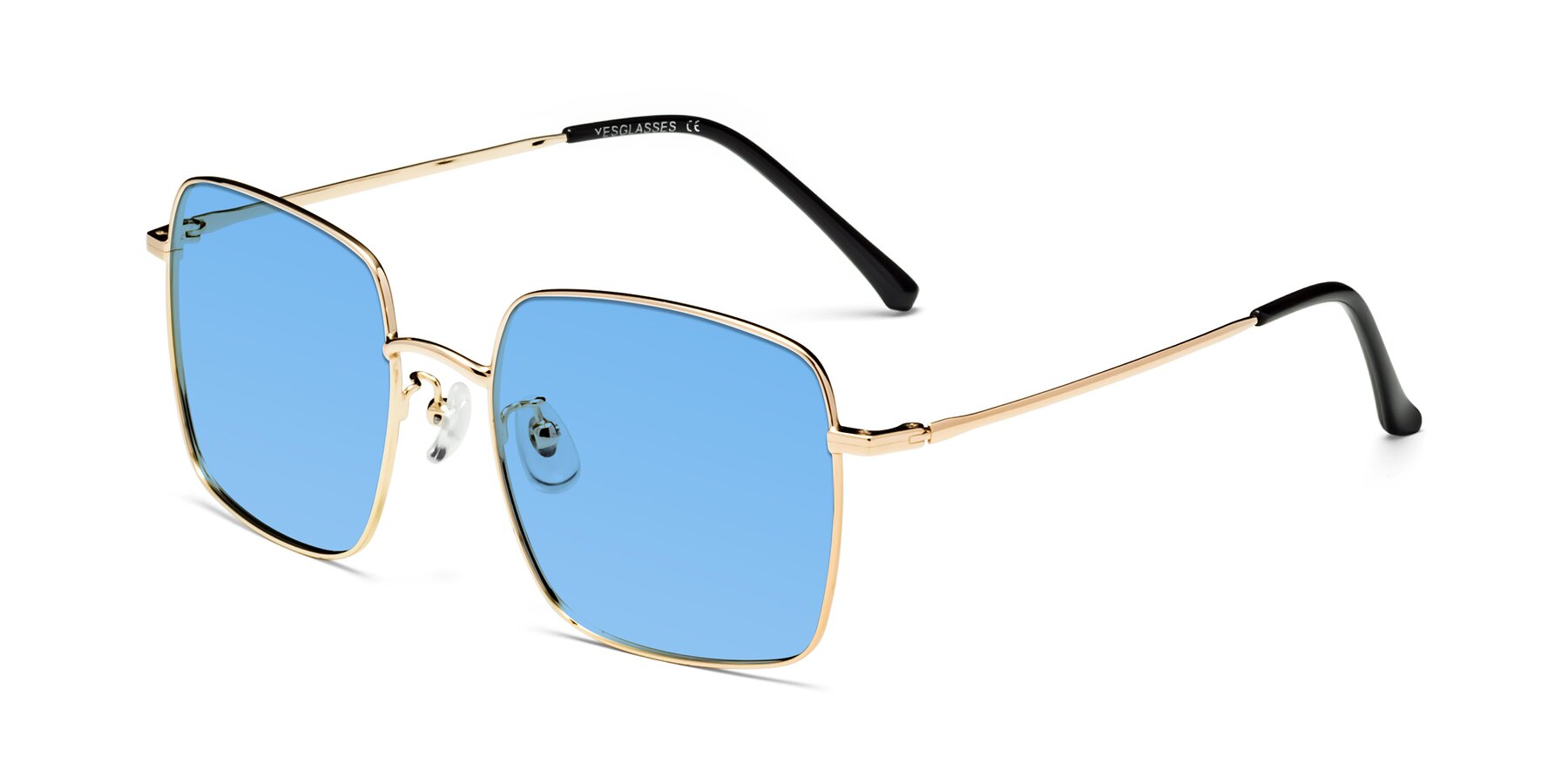 Angle of Billie in Gold with Medium Blue Tinted Lenses