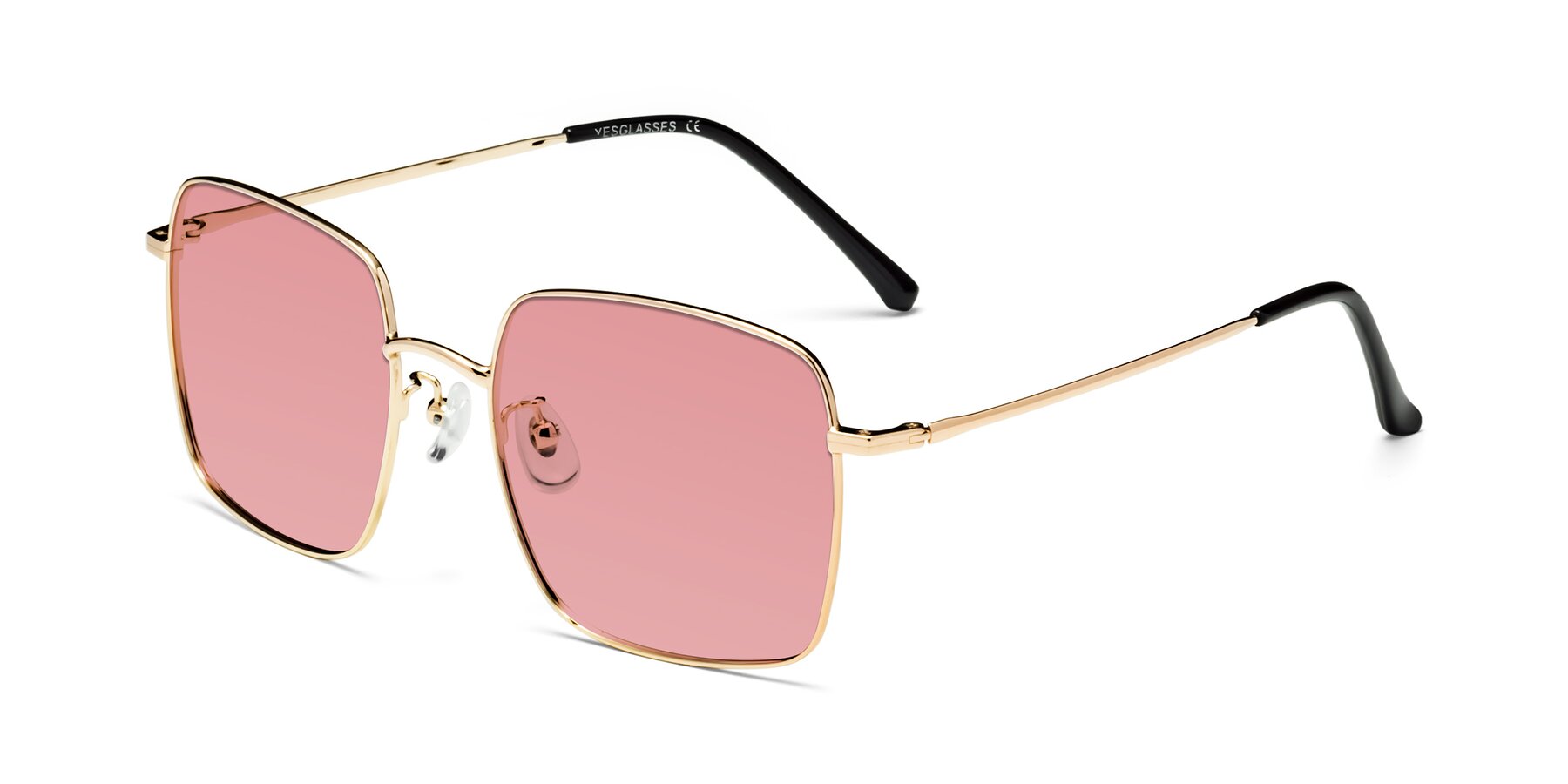 Angle of Billie in Gold with Medium Garnet Tinted Lenses