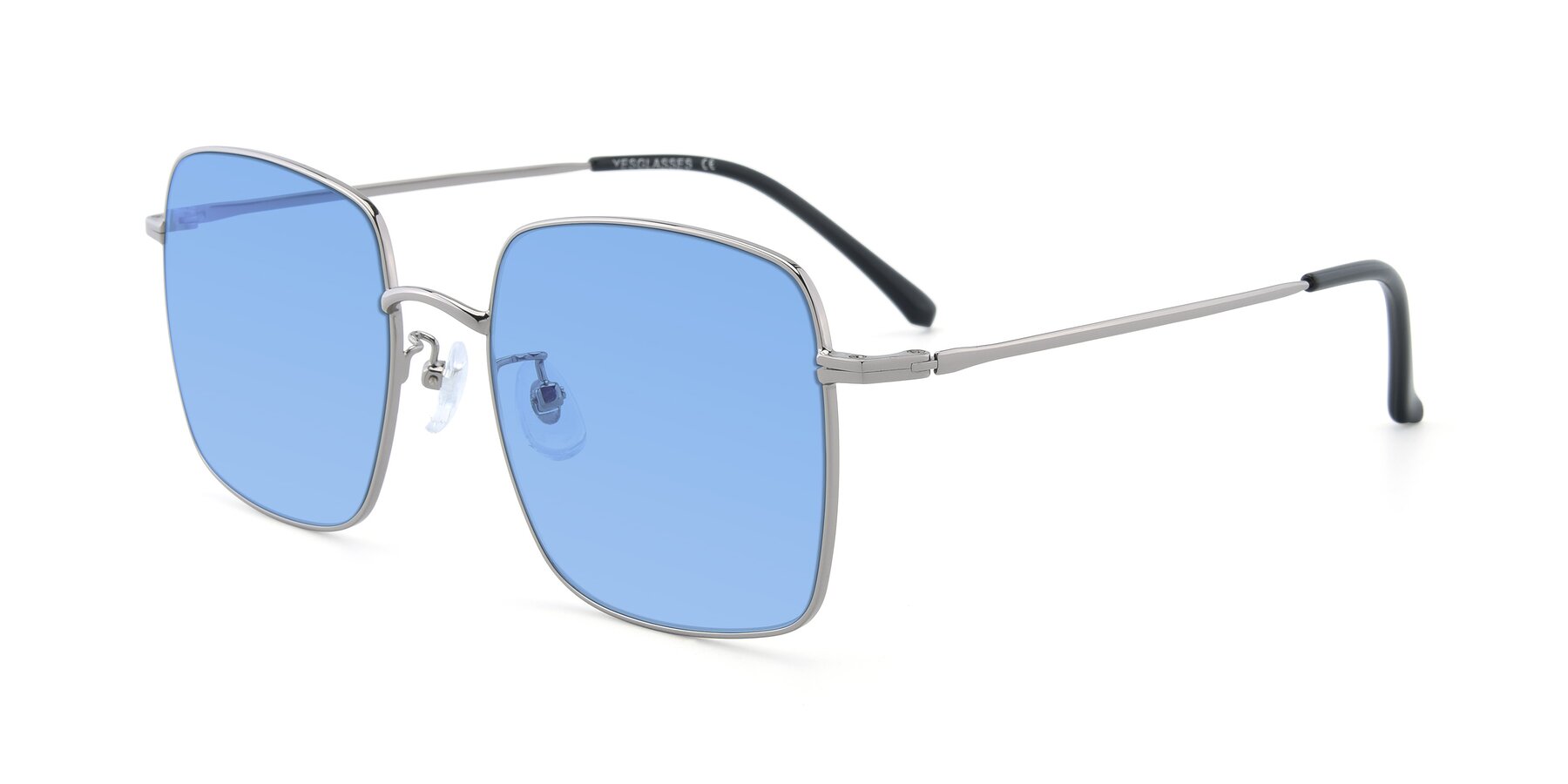 Angle of Billie in Silver with Medium Blue Tinted Lenses