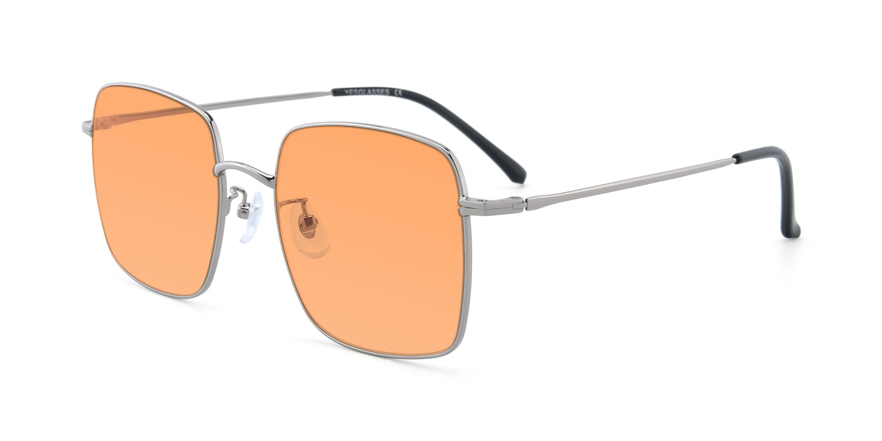 Angle of Billie in Silver with Medium Orange Tinted Lenses