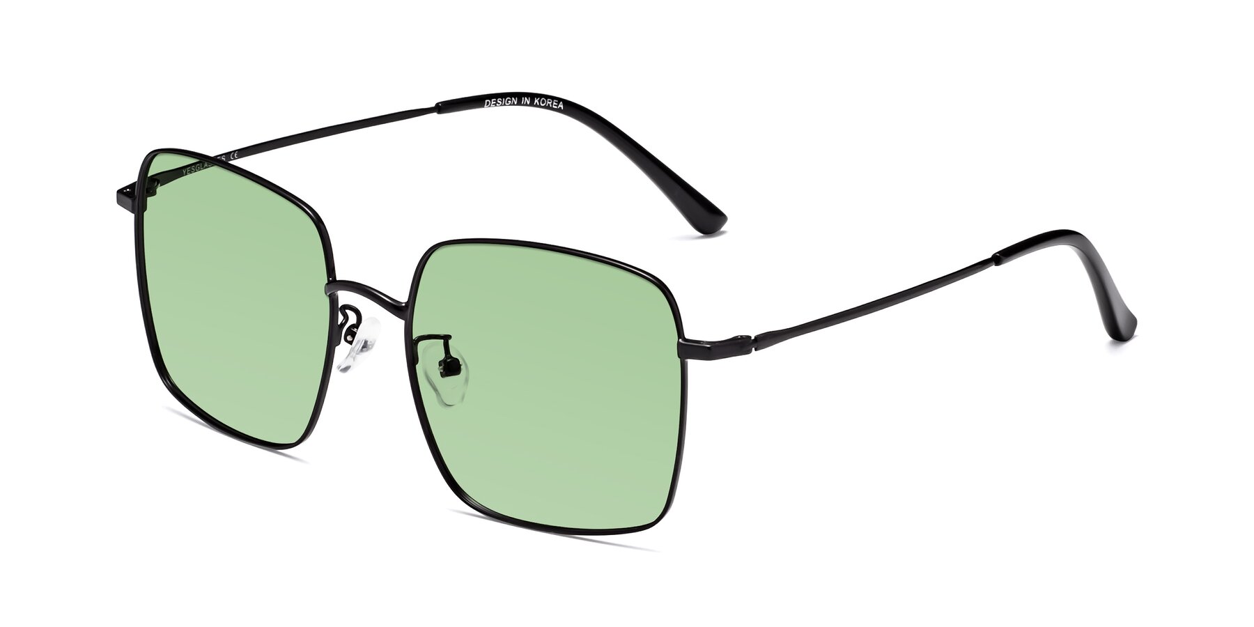 Angle of Billie in Black with Medium Green Tinted Lenses