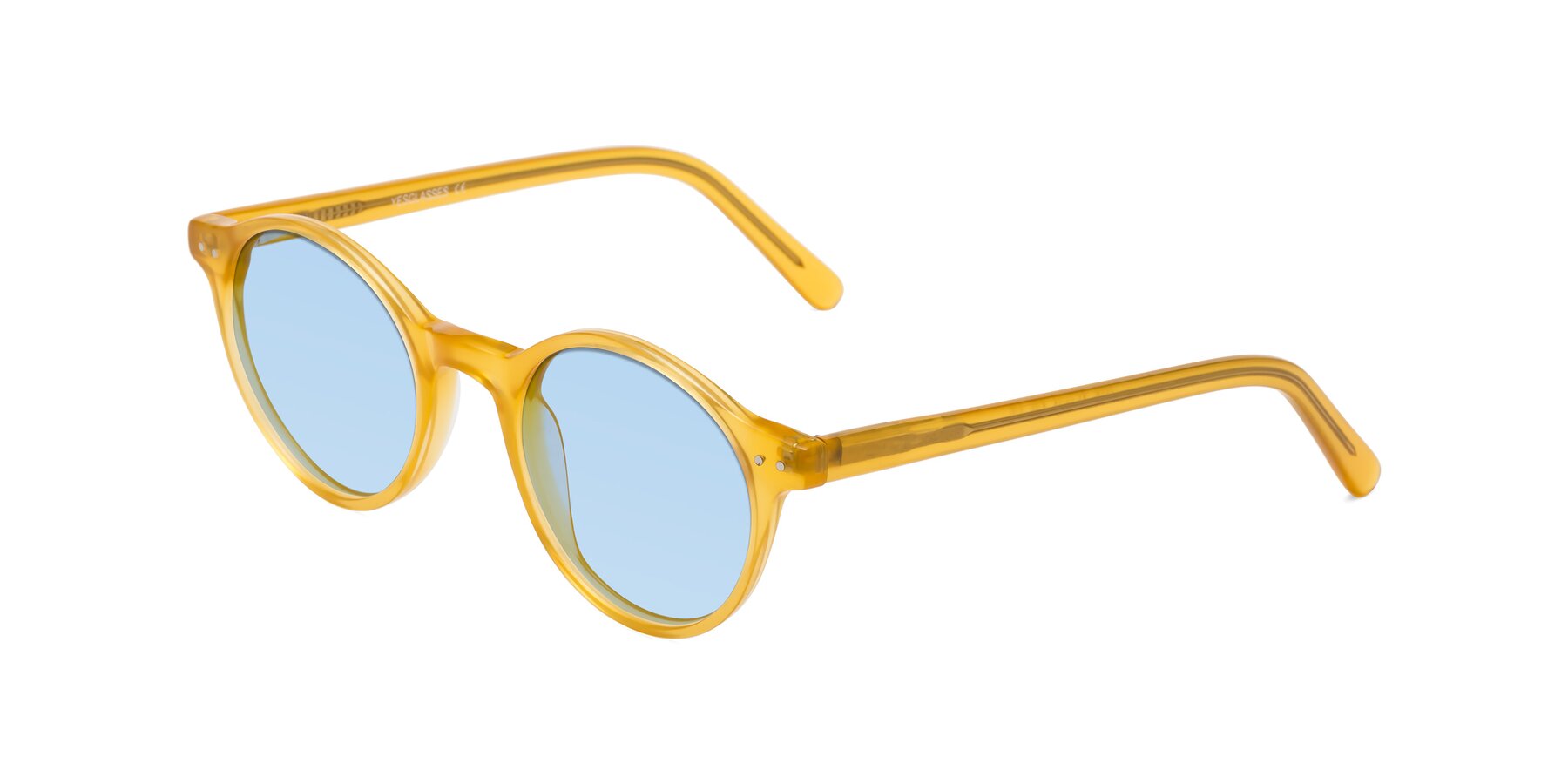 Angle of Jardi in Honey with Light Blue Tinted Lenses