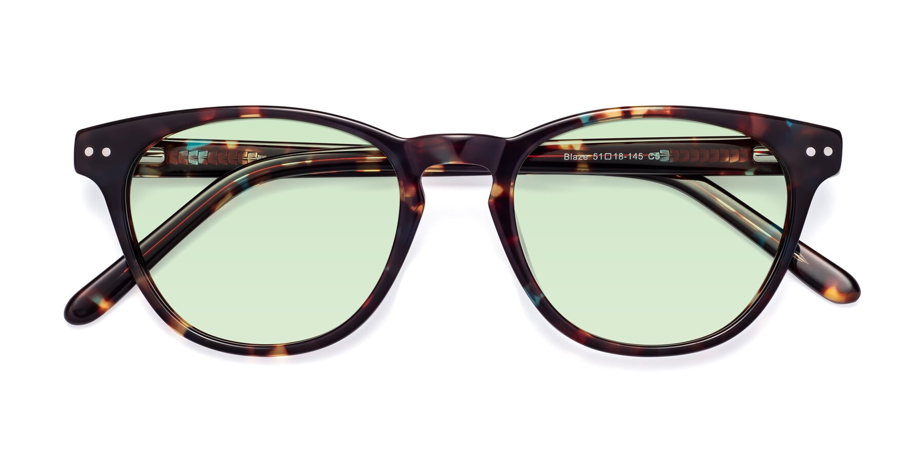 Folded Front of Blaze in Floral Tortoise with Light Green Tinted Lenses