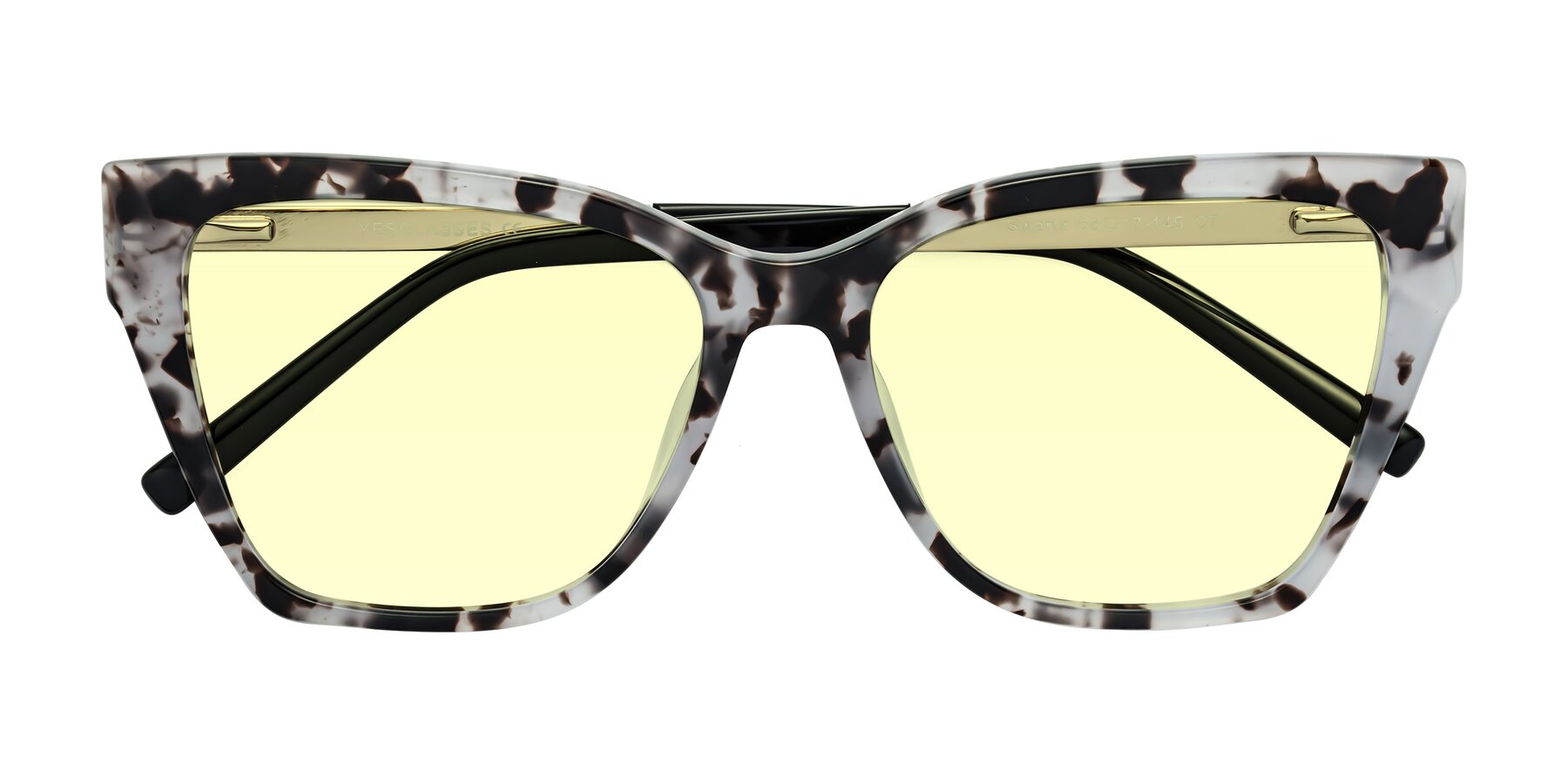 Folded Front of Swartz in White Tortoise with Light Yellow Tinted Lenses
