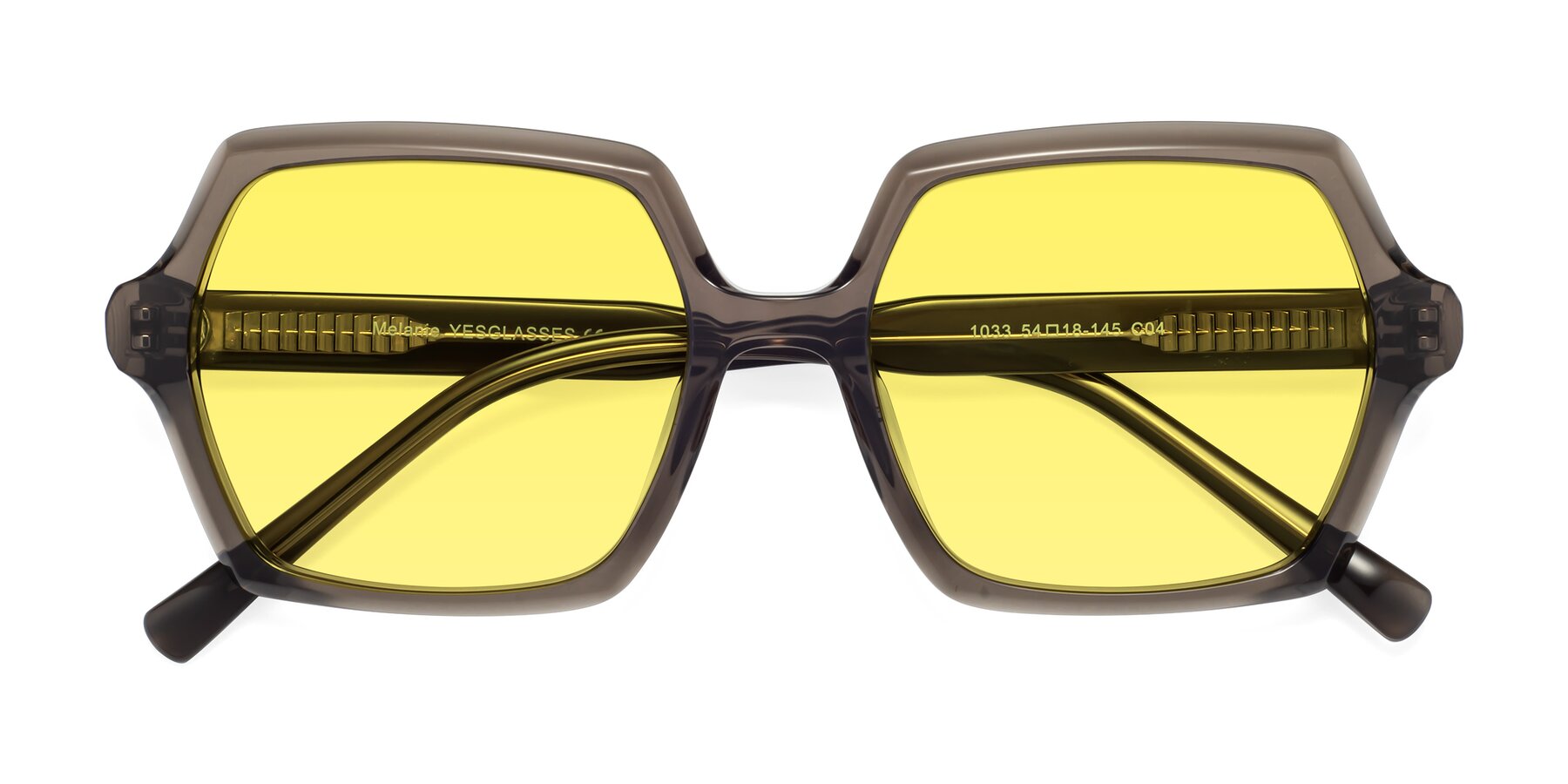 Folded Front of Melanie in Transparent Gray with Medium Yellow Tinted Lenses
