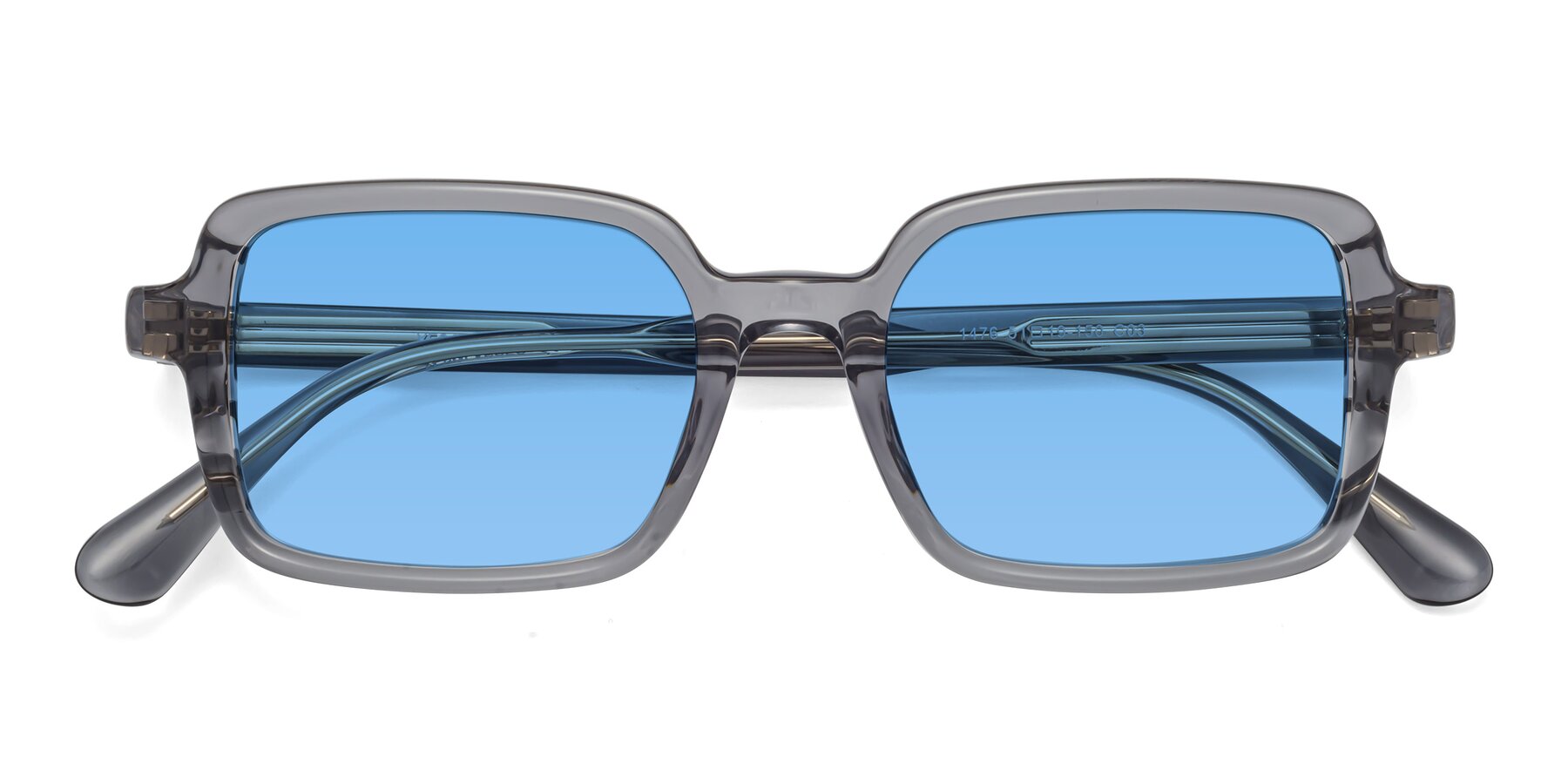 Folded Front of Canuto in Transparent Gray with Medium Blue Tinted Lenses
