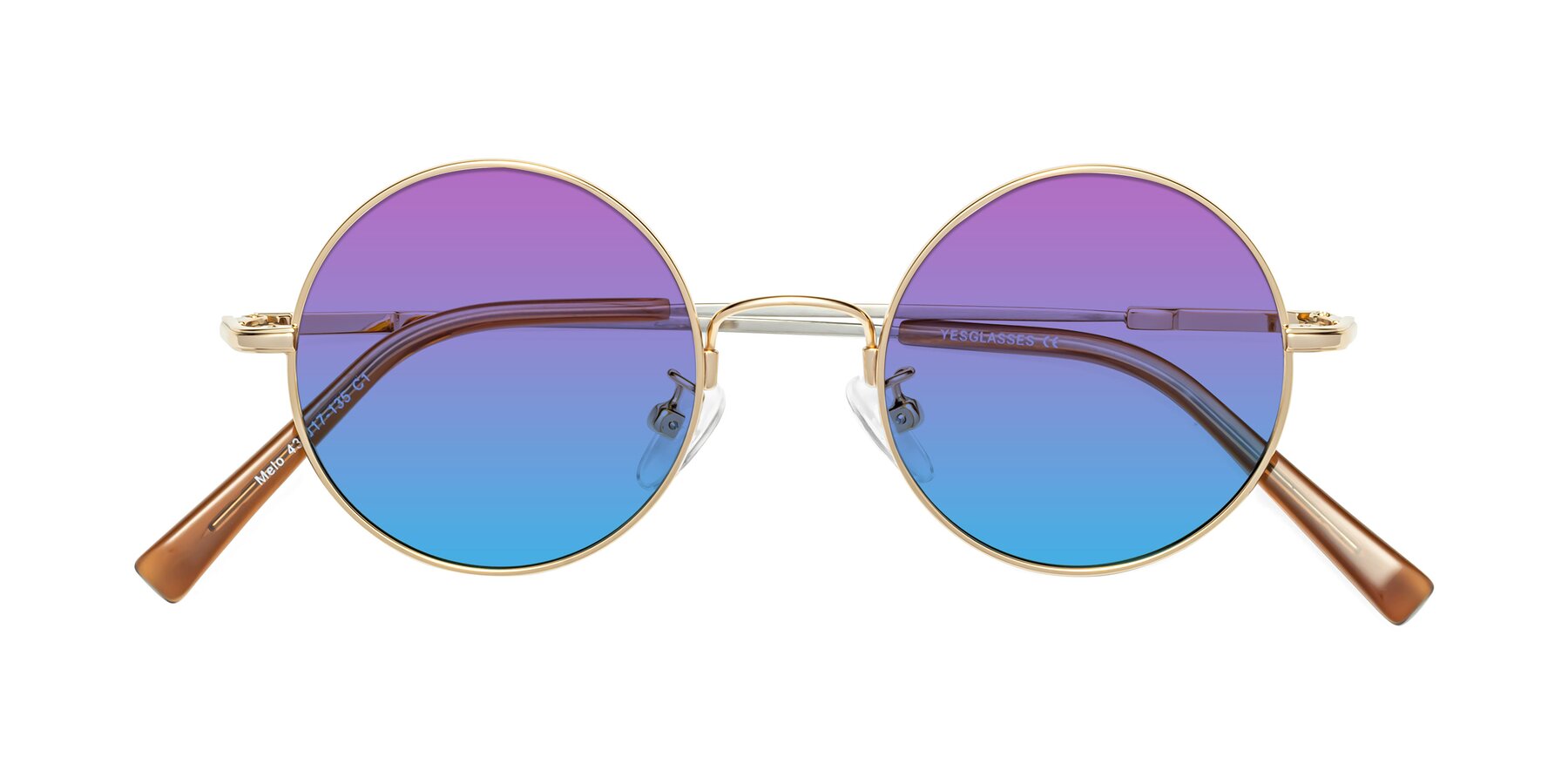 Folded Front of Melo in Gold with Purple / Blue Gradient Lenses