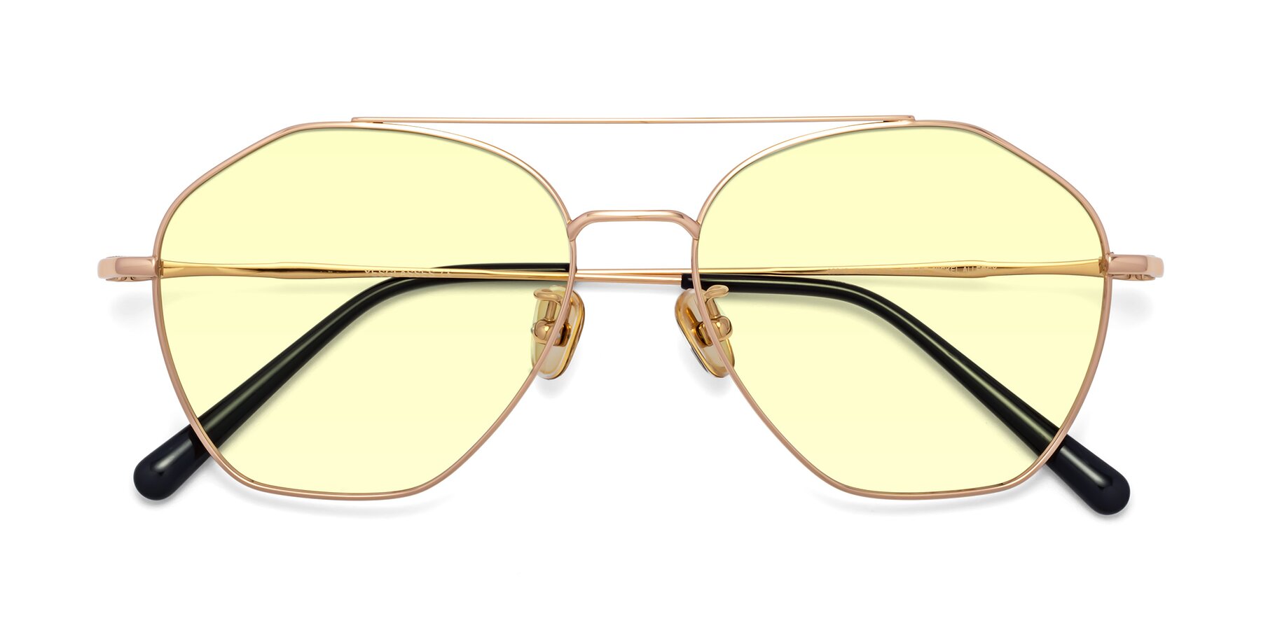 Folded Front of Linton in Rose Gold with Light Yellow Tinted Lenses