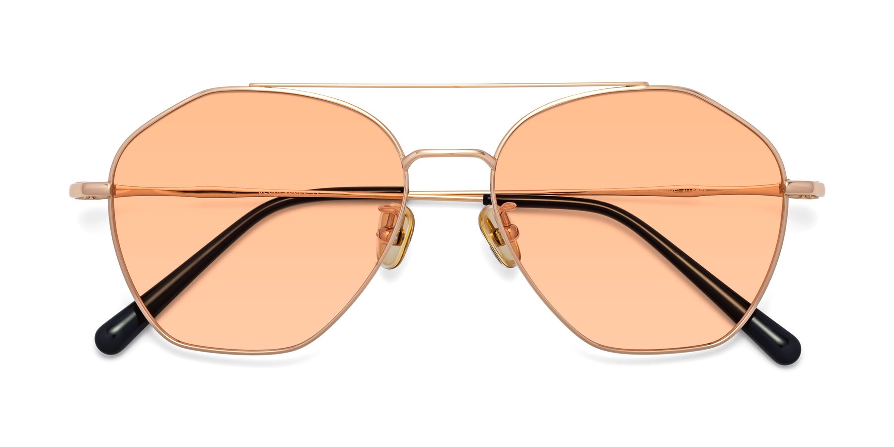 Folded Front of Linton in Rose Gold with Light Orange Tinted Lenses