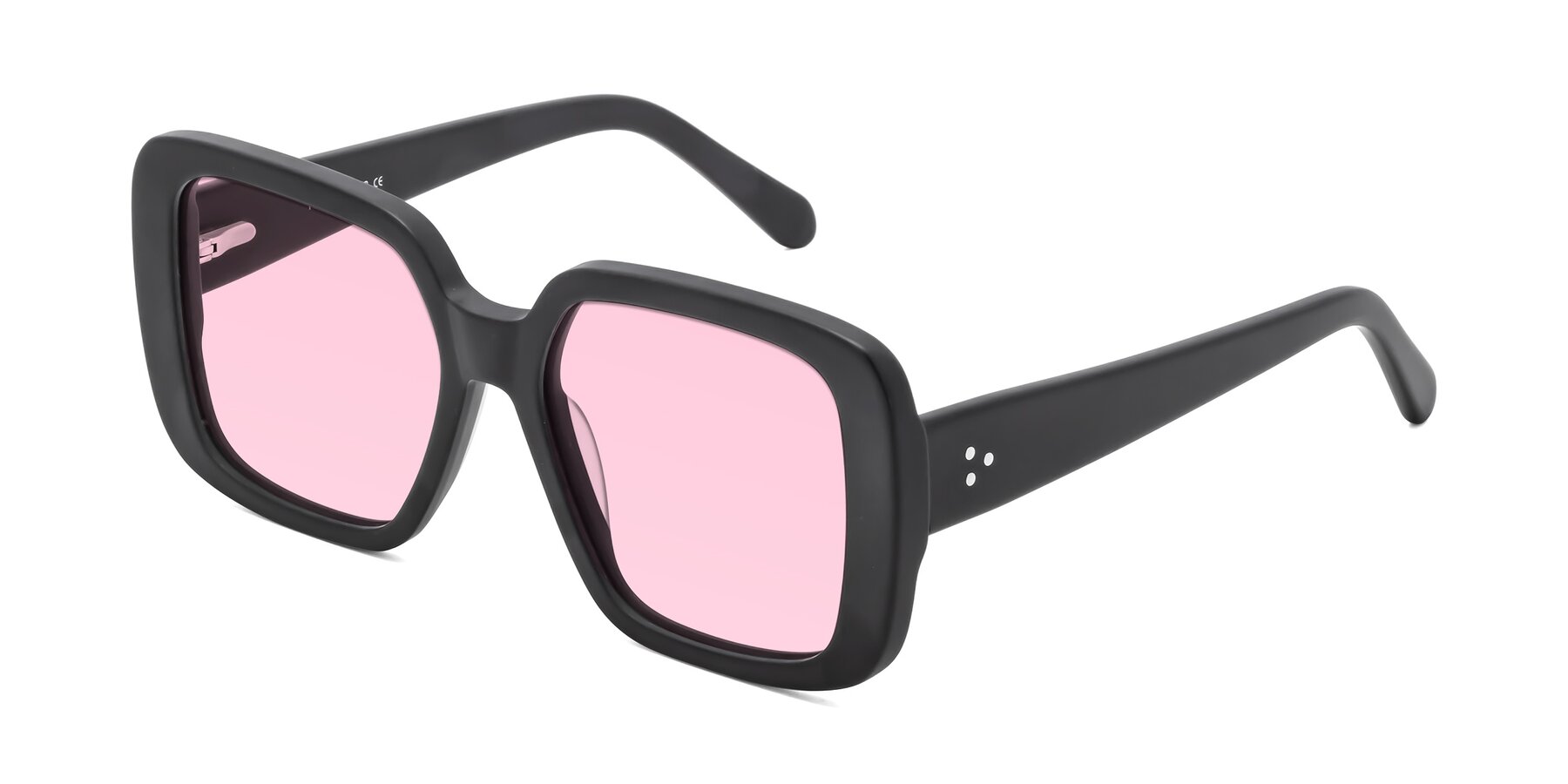 Angle of Quotus in Matte Black with Light Pink Tinted Lenses