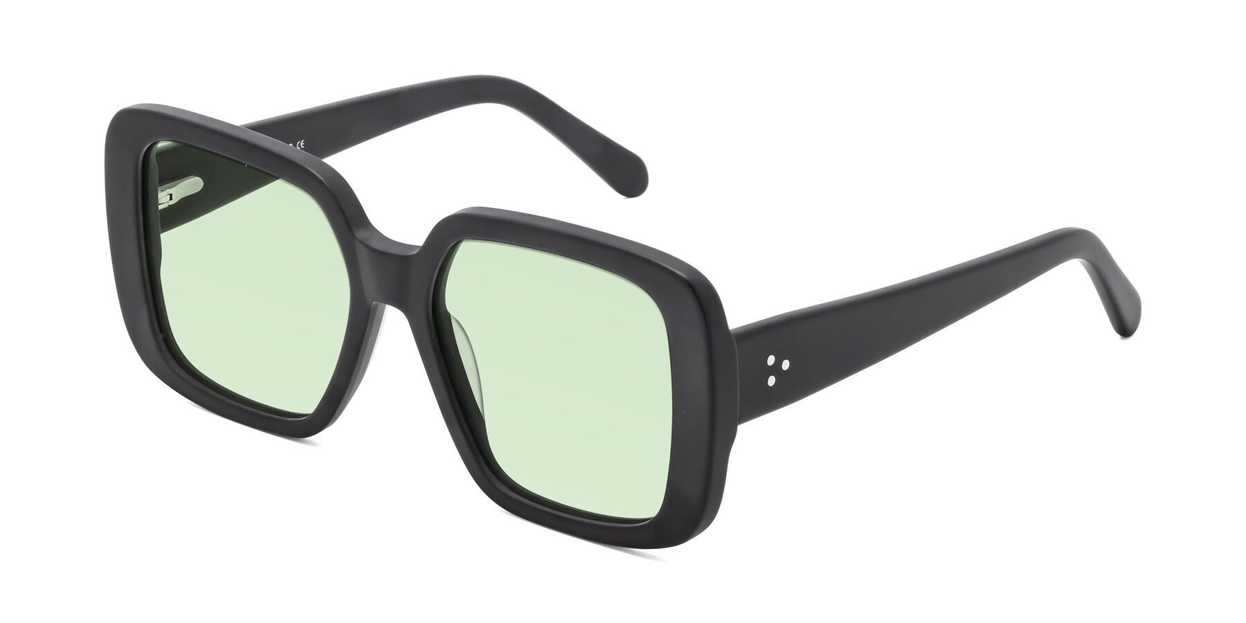 Angle of Quotus in Matte Black with Light Green Tinted Lenses