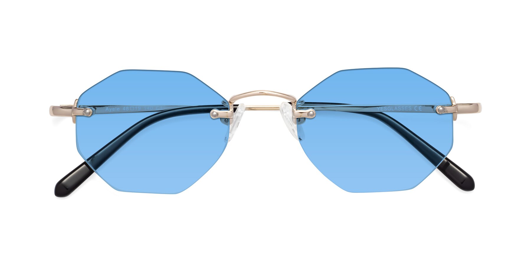 Folded Front of Ayele in Light Gold with Medium Blue Tinted Lenses