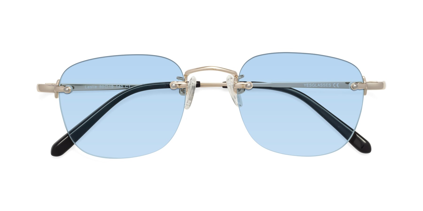 Folded Front of Leslie in Light Gold with Light Blue Tinted Lenses