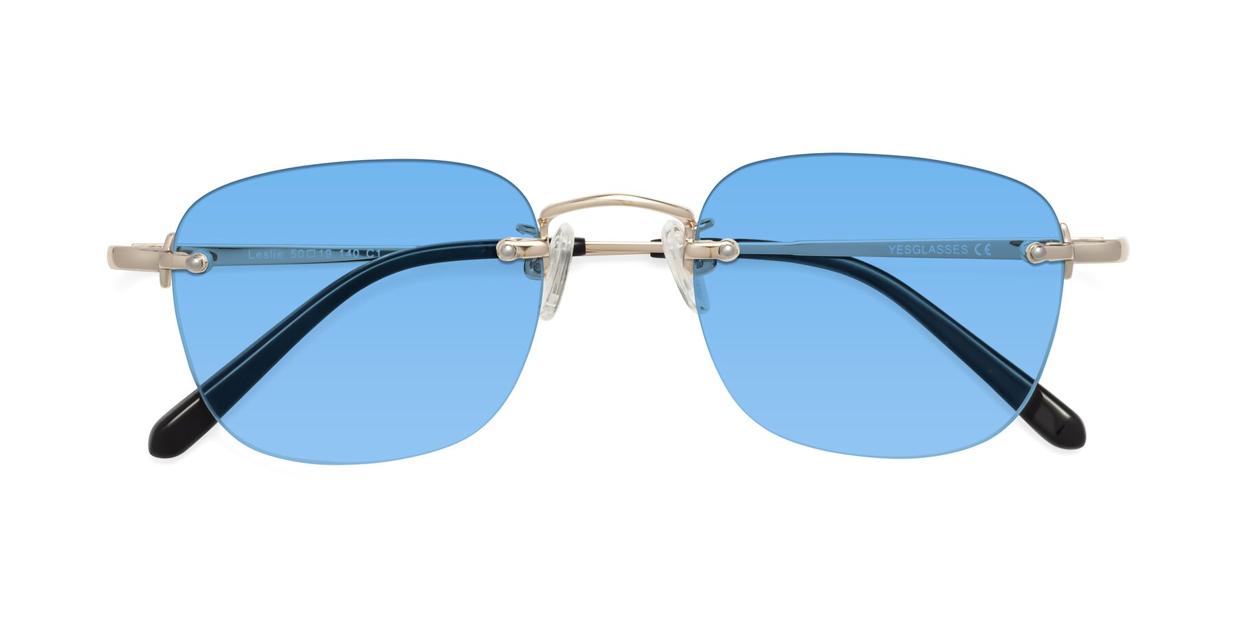 Folded Front of Leslie in Light Gold with Medium Blue Tinted Lenses