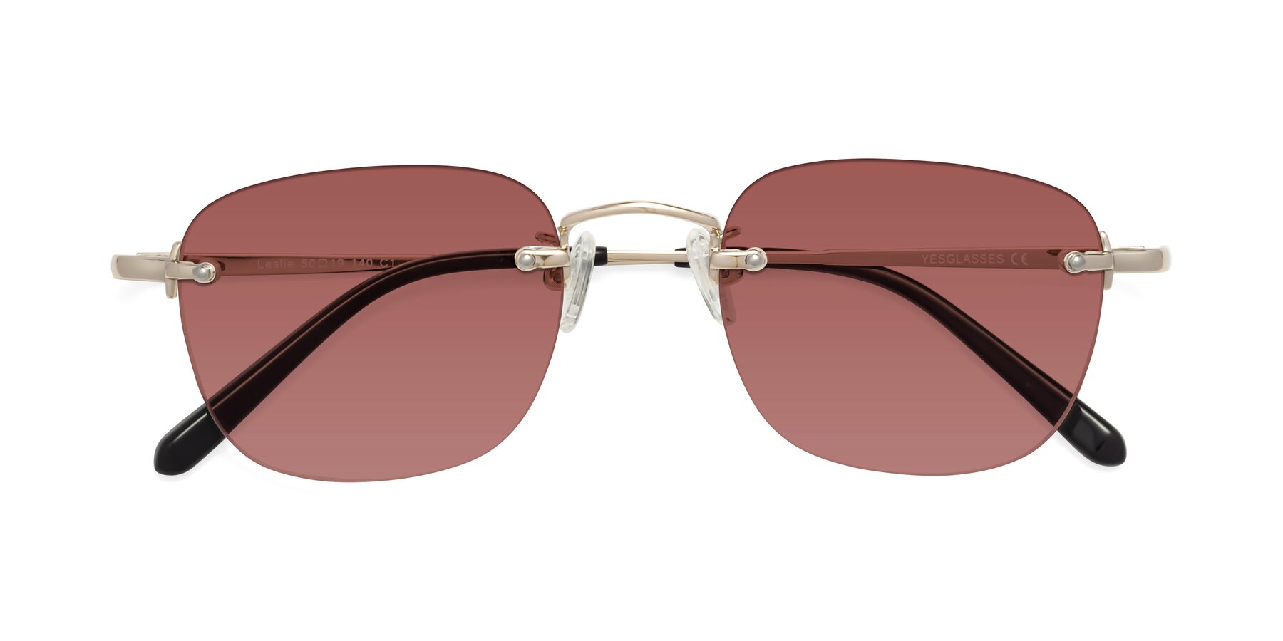 Folded Front of Leslie in Light Gold with Garnet Tinted Lenses