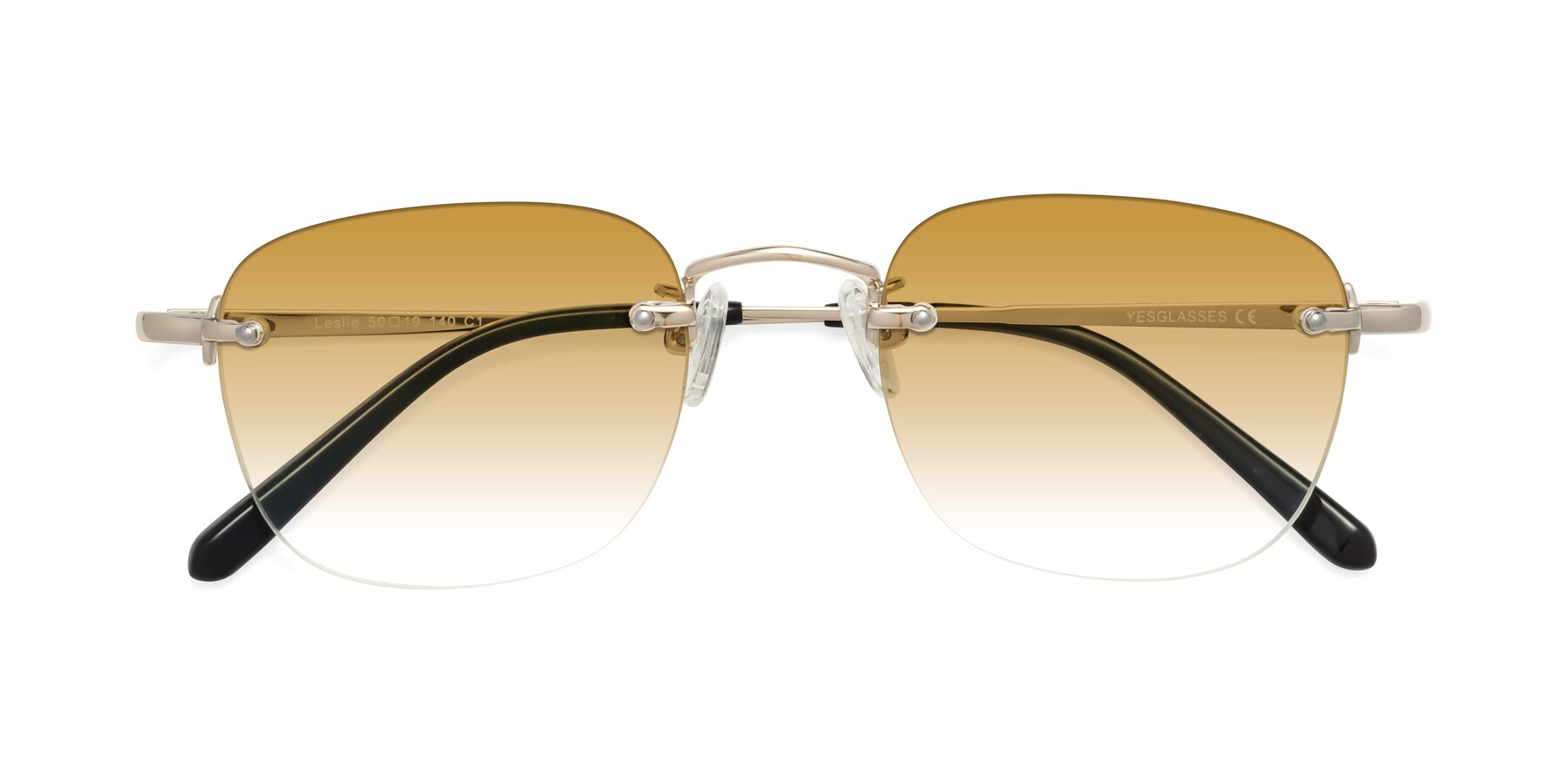 Folded Front of Leslie in Light Gold with Champagne Gradient Lenses