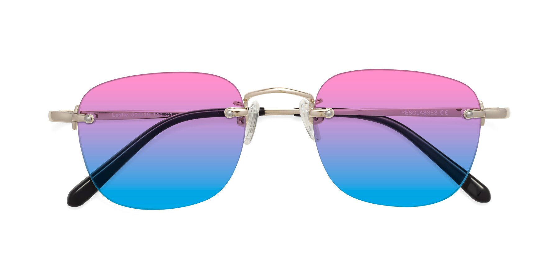 Folded Front of Leslie in Gold with Pink / Blue Gradient Lenses