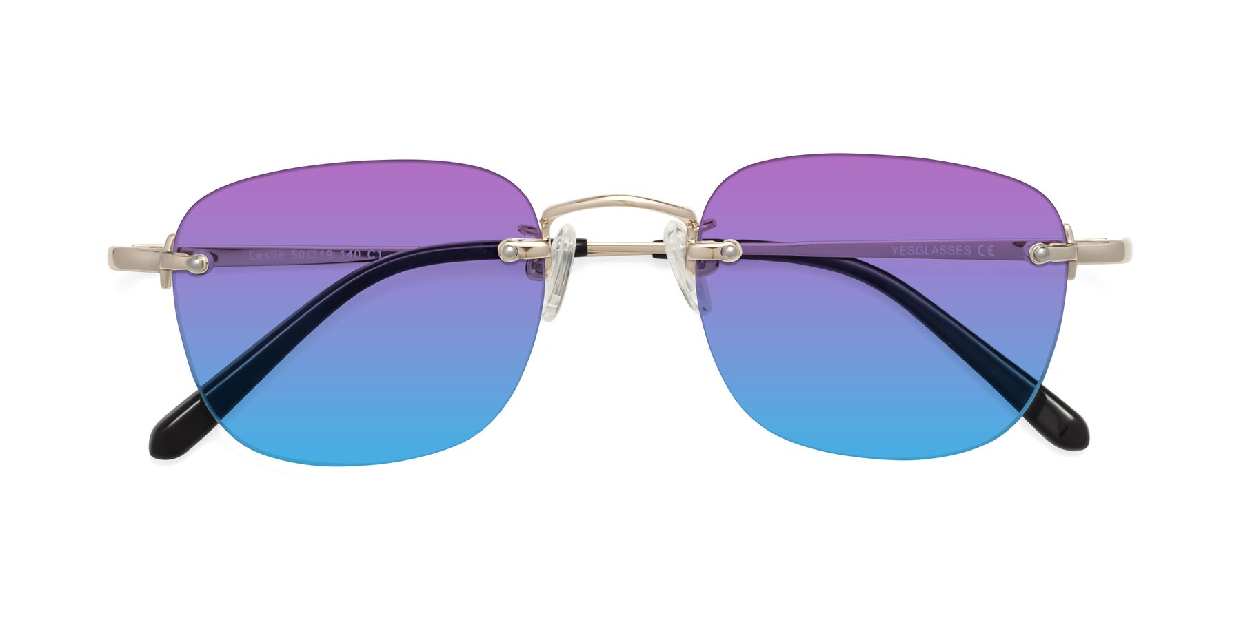 Folded Front of Leslie in Light Gold with Purple / Blue Gradient Lenses