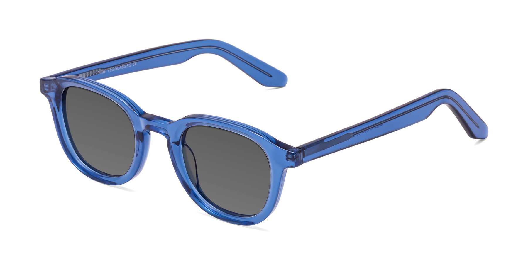 Angle of Titus in Translucent Blue with Medium Gray Tinted Lenses