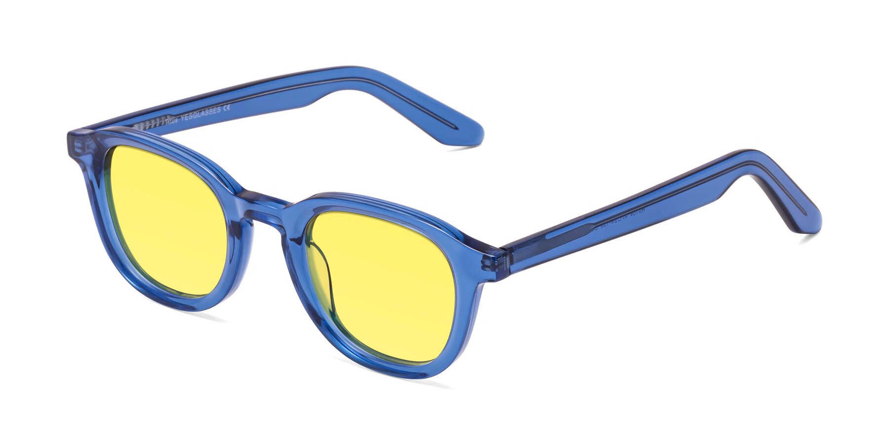 Angle of Titus in Translucent Blue with Medium Yellow Tinted Lenses