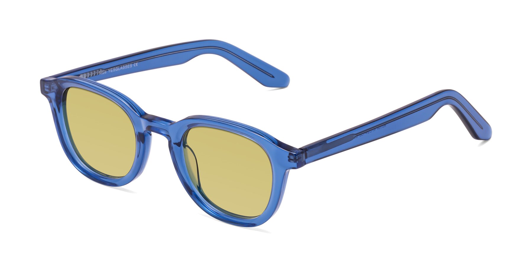 Angle of Titus in Translucent Blue with Medium Champagne Tinted Lenses