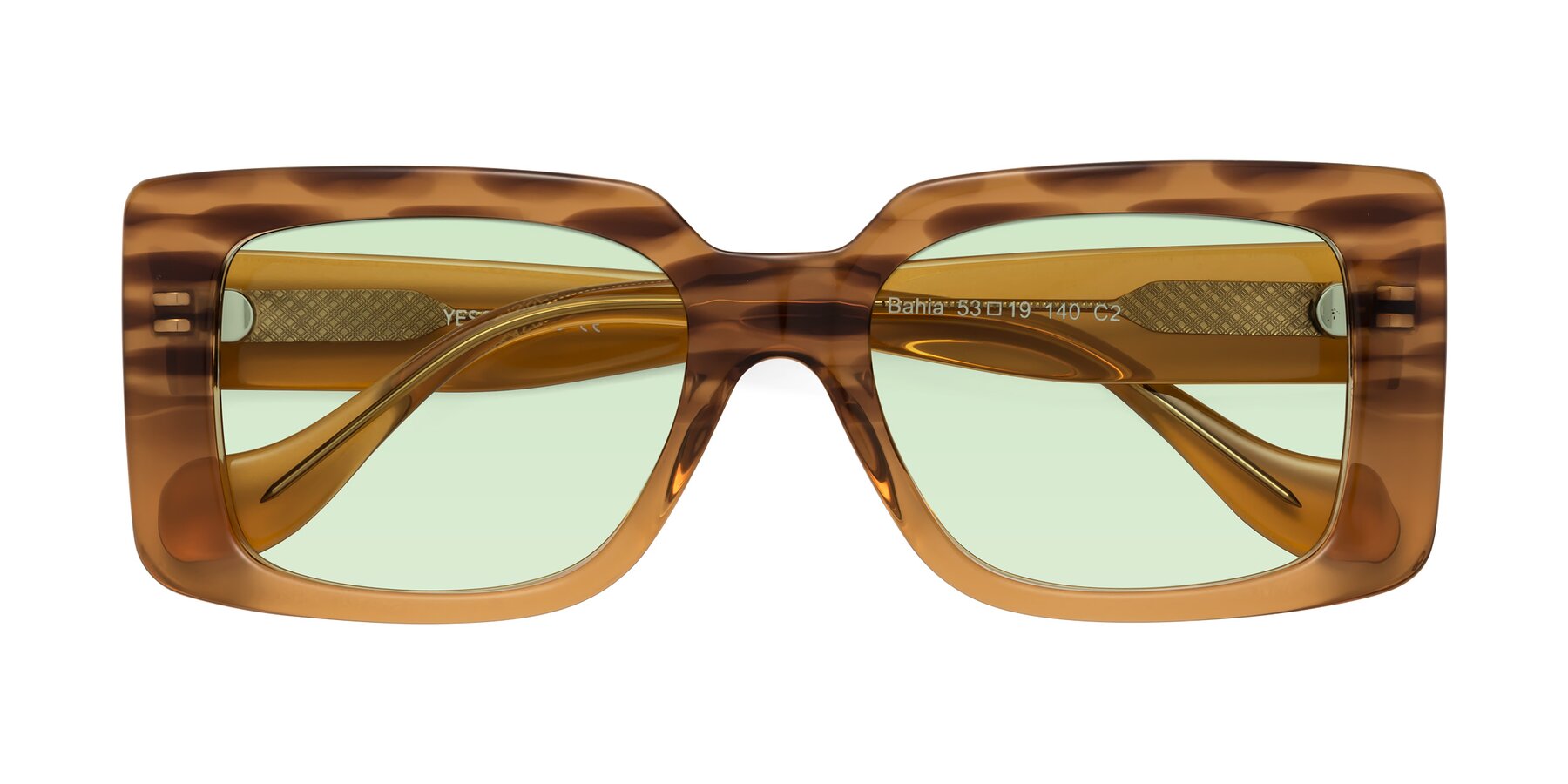 Folded Front of Bahia in Amber Striped with Light Green Tinted Lenses