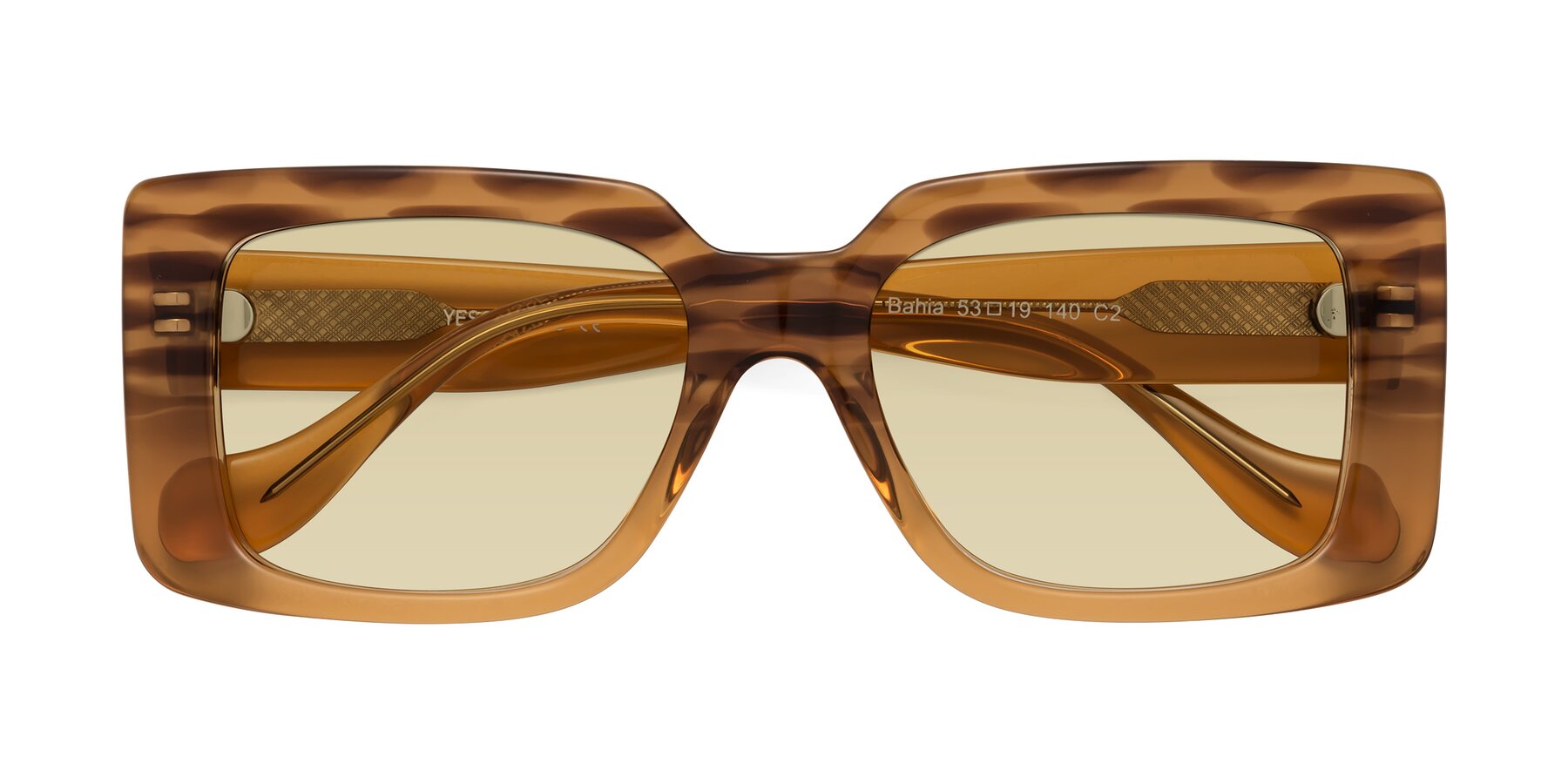 Folded Front of Bahia in Amber Striped with Light Champagne Tinted Lenses