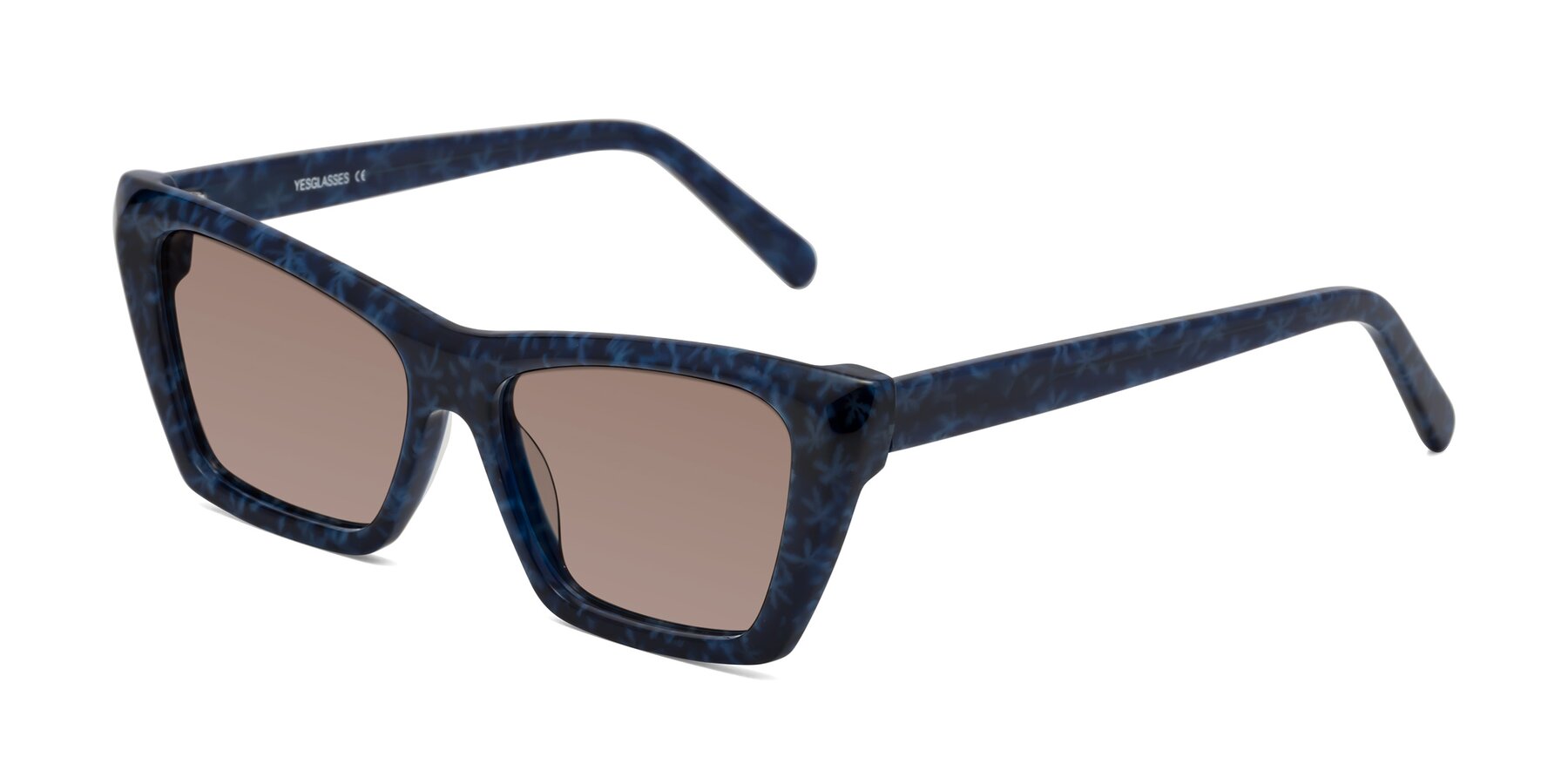 Angle of Khoi in Blue Snowflake with Medium Brown Tinted Lenses