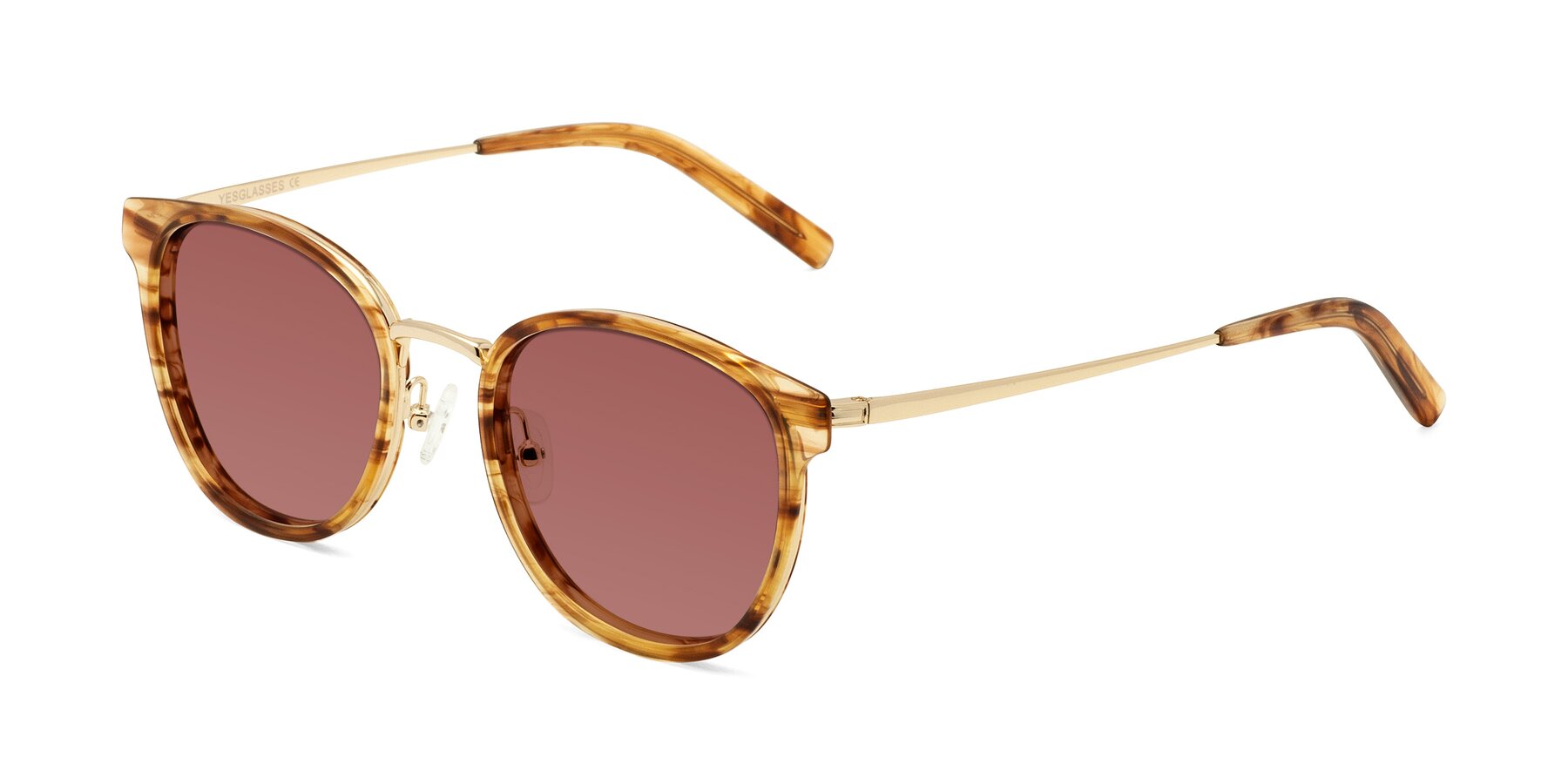 Angle of Callie in Amber Striped with Garnet Tinted Lenses