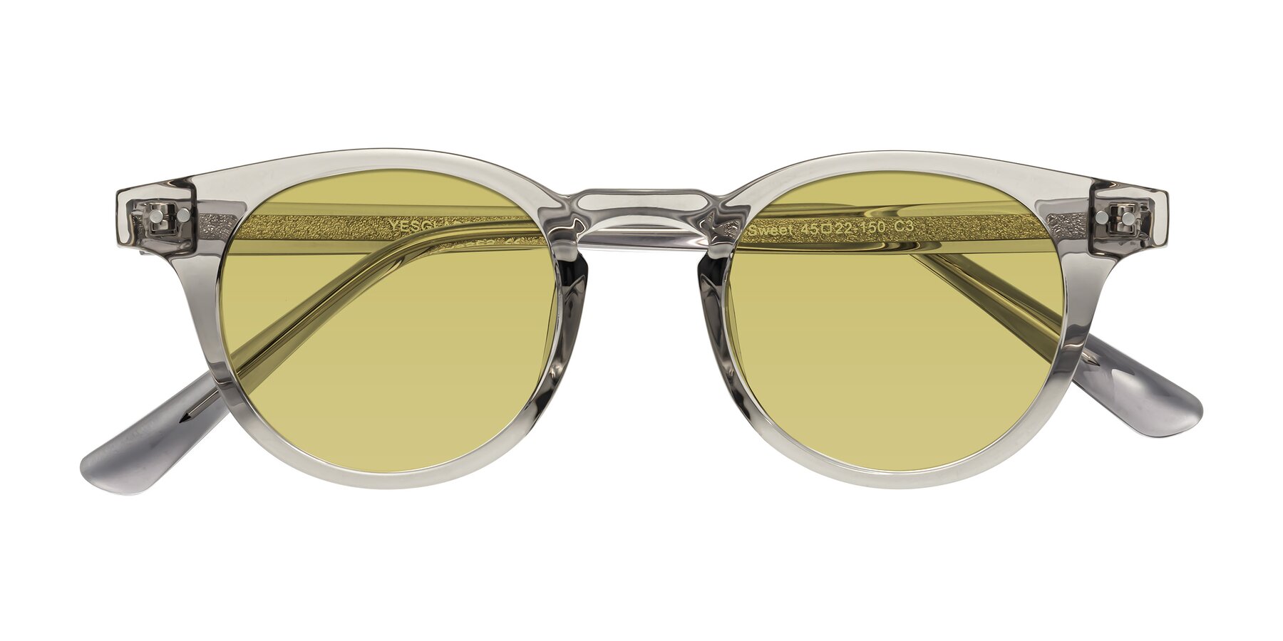 Folded Front of Sweet in Translucent Gray with Medium Champagne Tinted Lenses