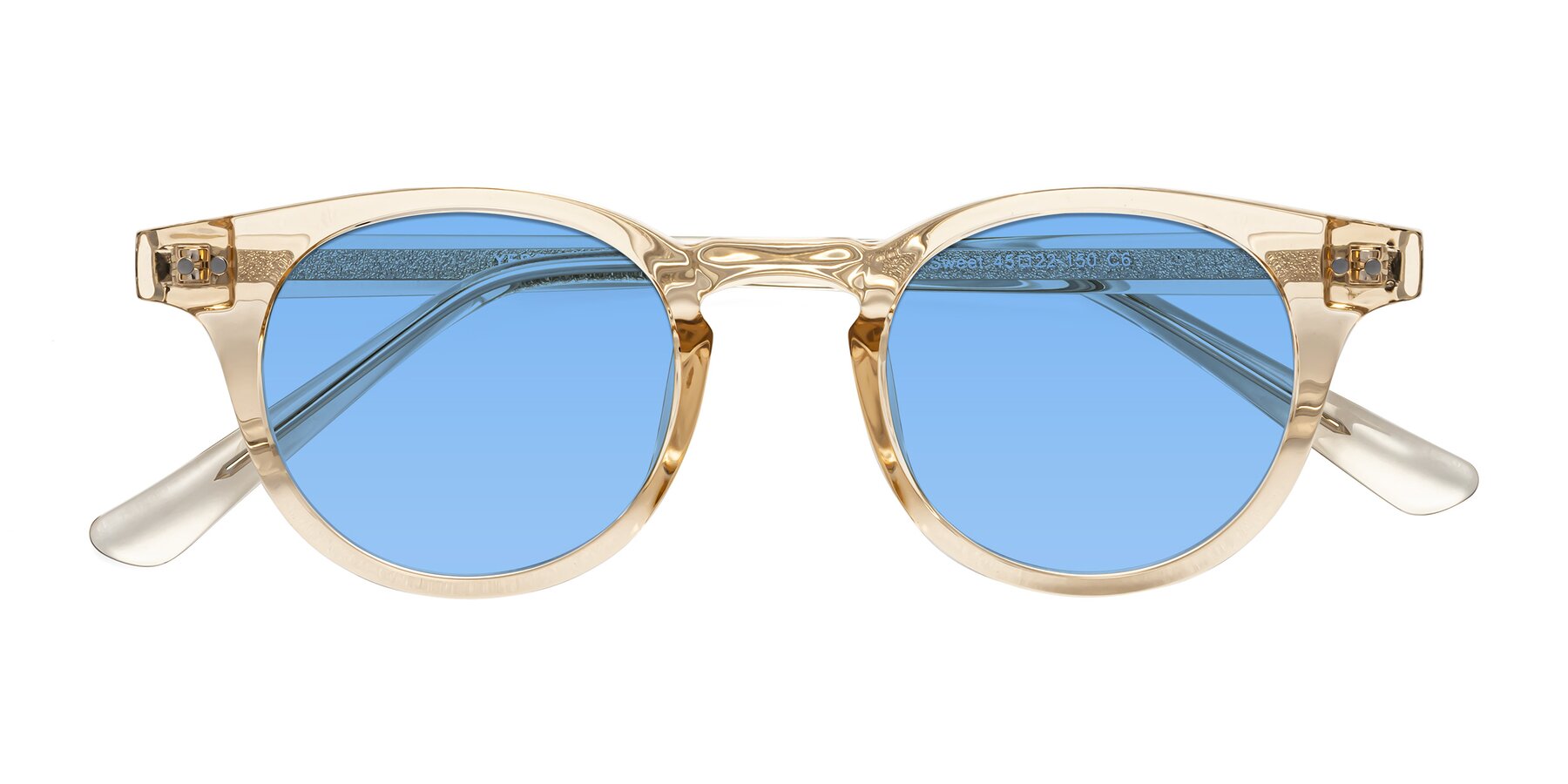 Folded Front of Sweet in Champagne with Medium Blue Tinted Lenses