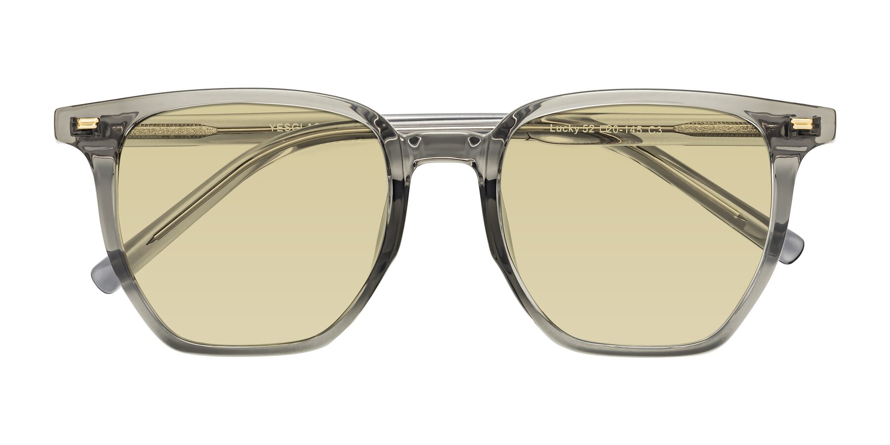 Folded Front of Lucky in Translucent Gray with Light Champagne Tinted Lenses