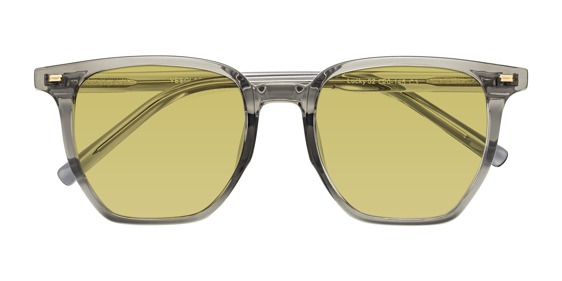 Folded Front of Lucky in Translucent Gray with Medium Champagne Tinted Lenses