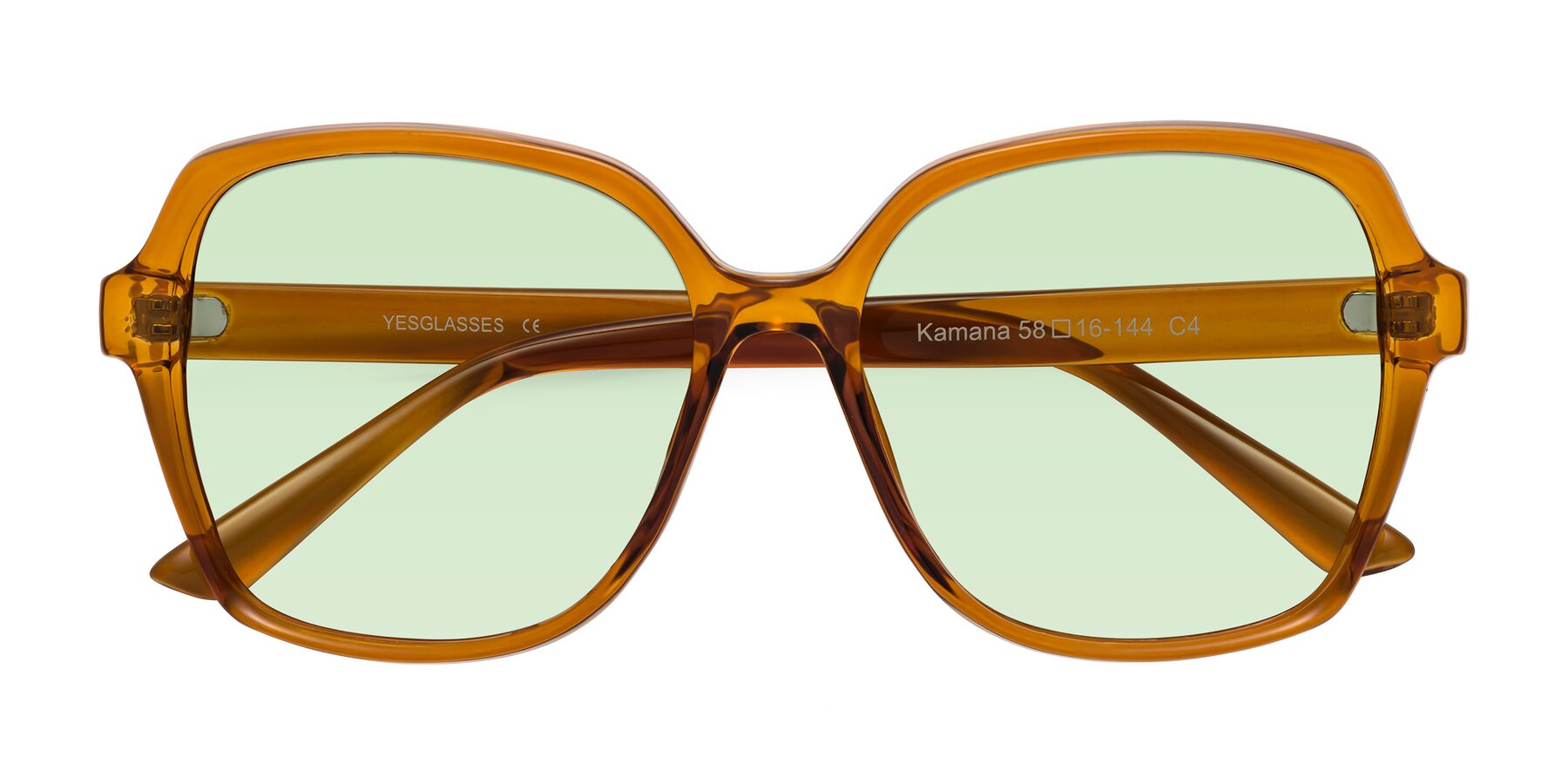 Folded Front of Kamana in Maple Syrup with Light Green Tinted Lenses
