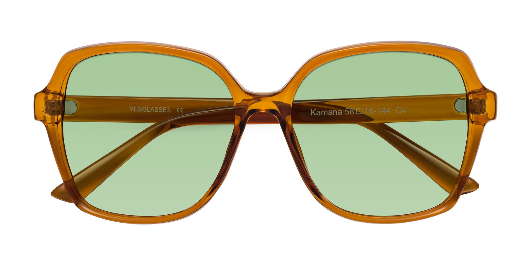 Folded Front of Kamana in Maple Syrup with Medium Green Tinted Lenses