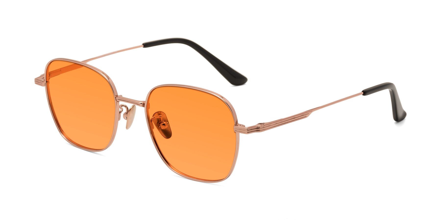 Angle of XING in Rose Gold with Orange Tinted Lenses