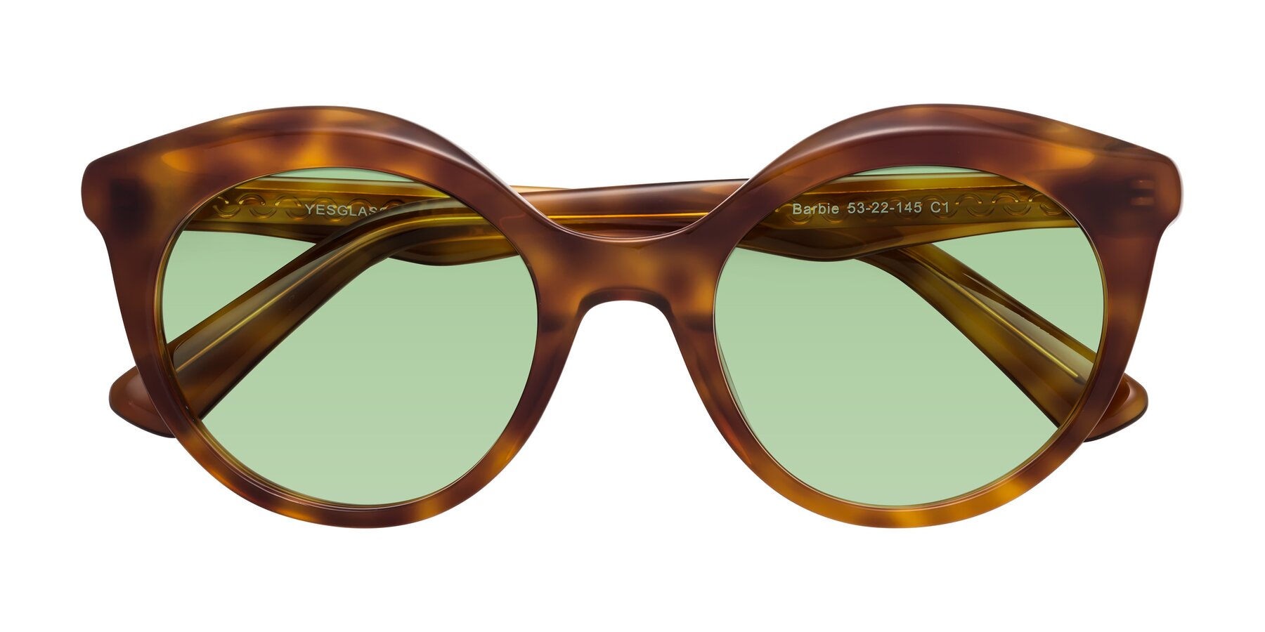 Folded Front of Barbie in Amber Tortoise with Medium Green Tinted Lenses