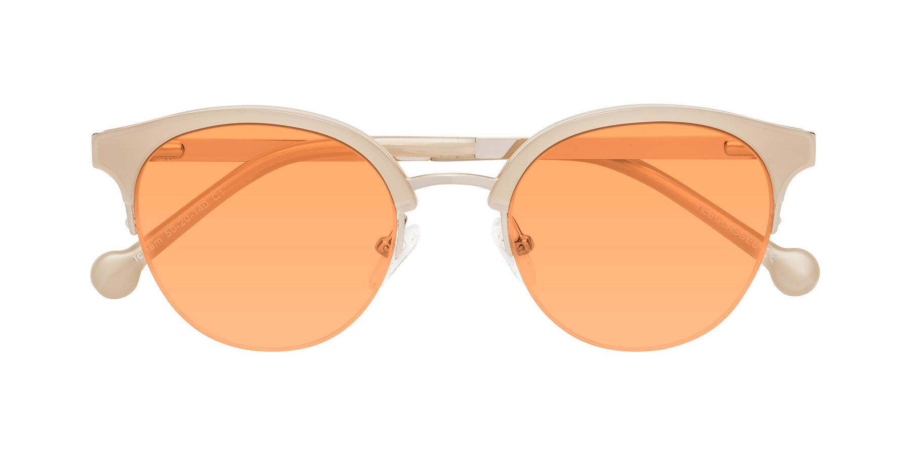 Folded Front of Icream in Beige-Gold with Medium Orange Tinted Lenses