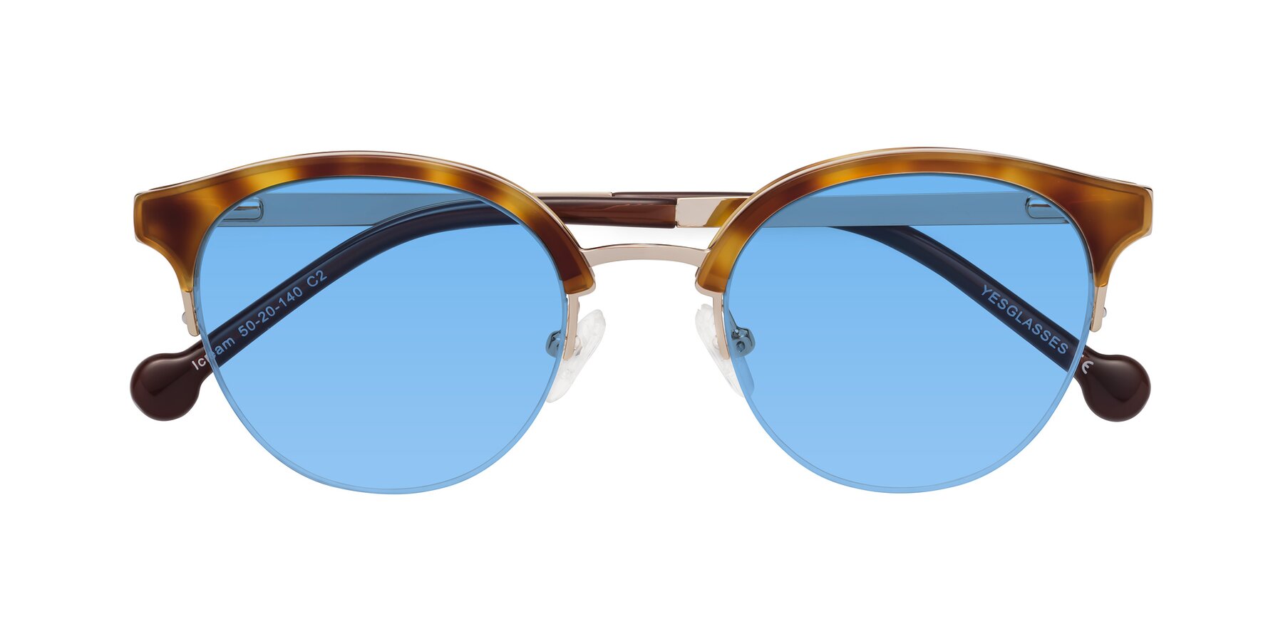 Folded Front of Icream in Tortoise-Gold with Medium Blue Tinted Lenses