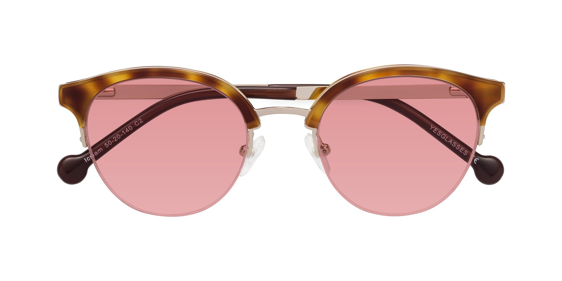 Folded Front of Icream in Tortoise-Gold with Medium Garnet Tinted Lenses