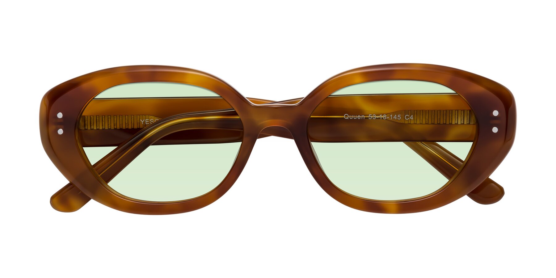 Folded Front of Quuen in Amber Tortoise with Light Green Tinted Lenses