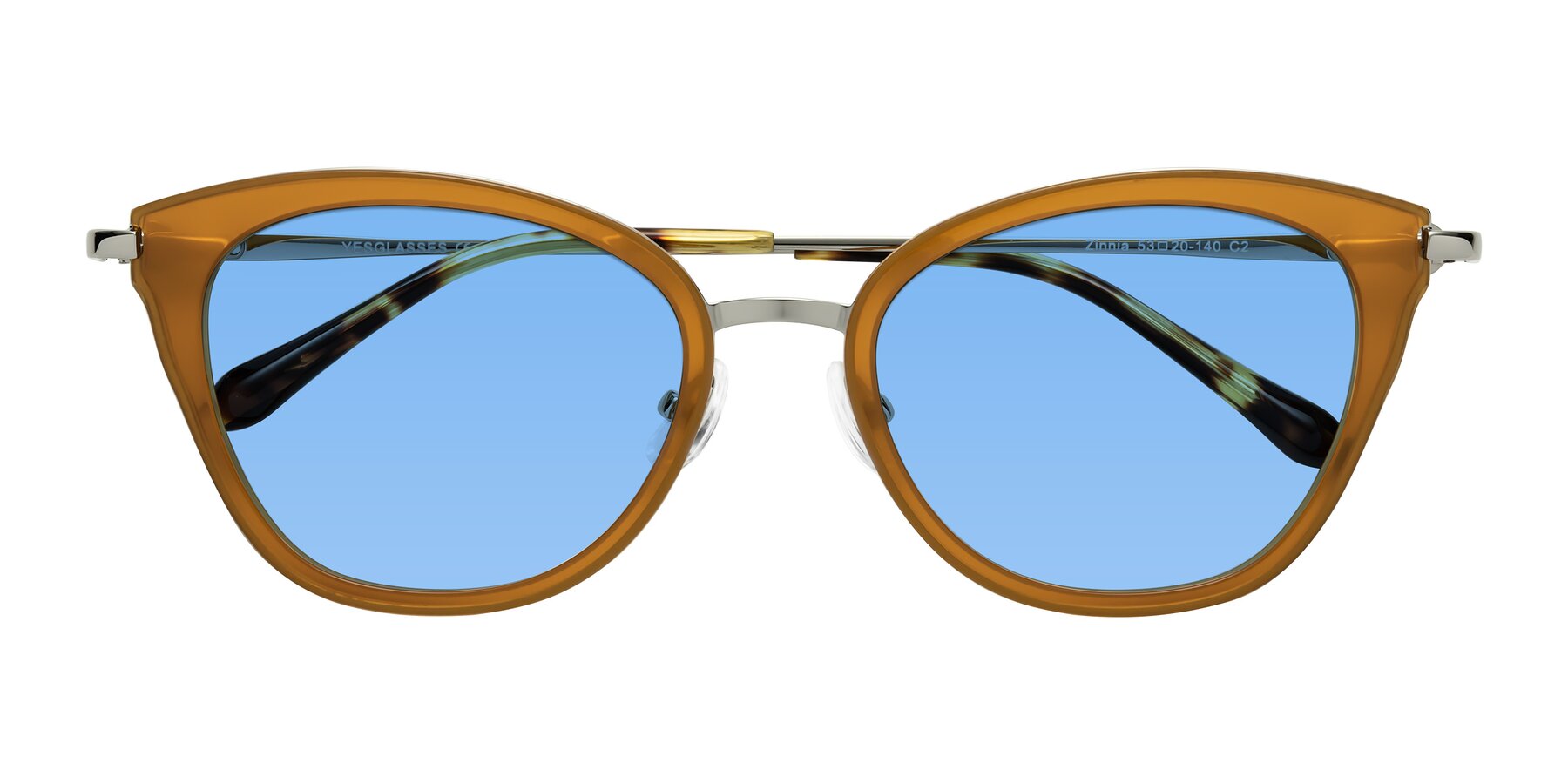 Folded Front of Zinnia in Caramel with Medium Blue Tinted Lenses