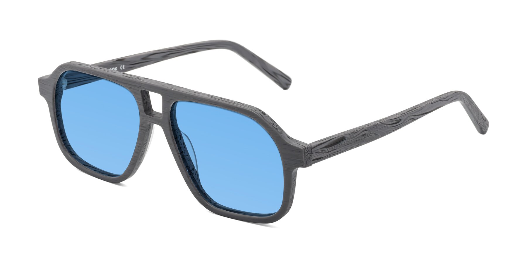 Angle of Edwood in Cement Woodgrain with Medium Blue Tinted Lenses