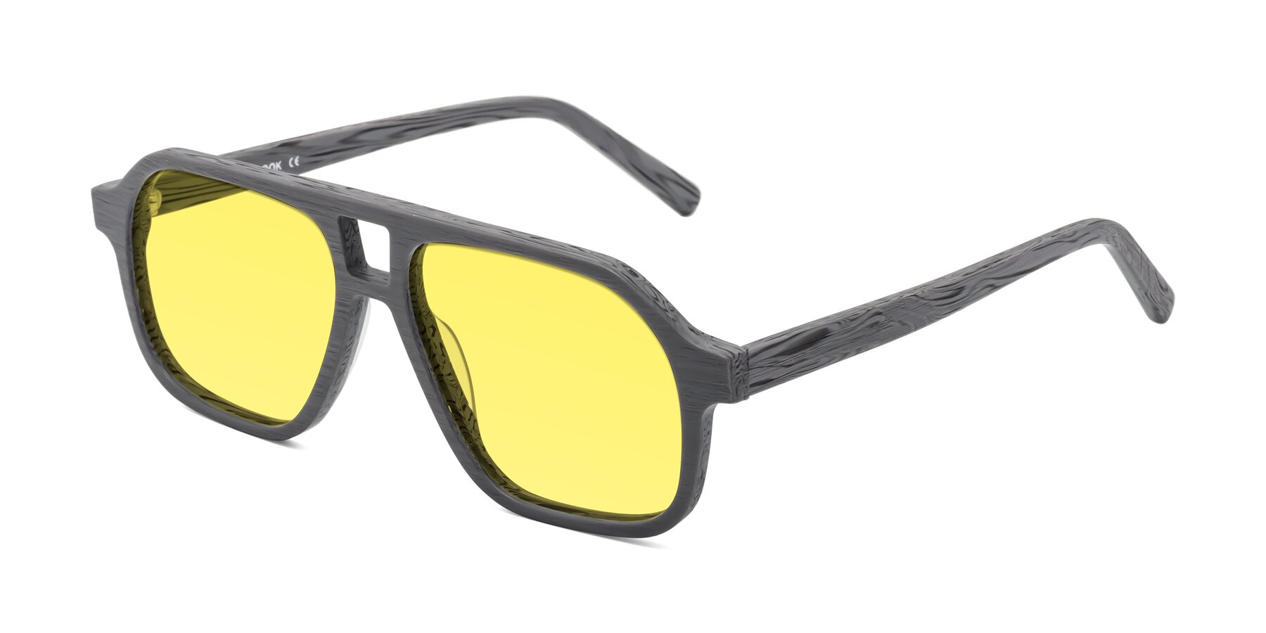 Angle of Edwood in Cement Woodgrain with Medium Yellow Tinted Lenses